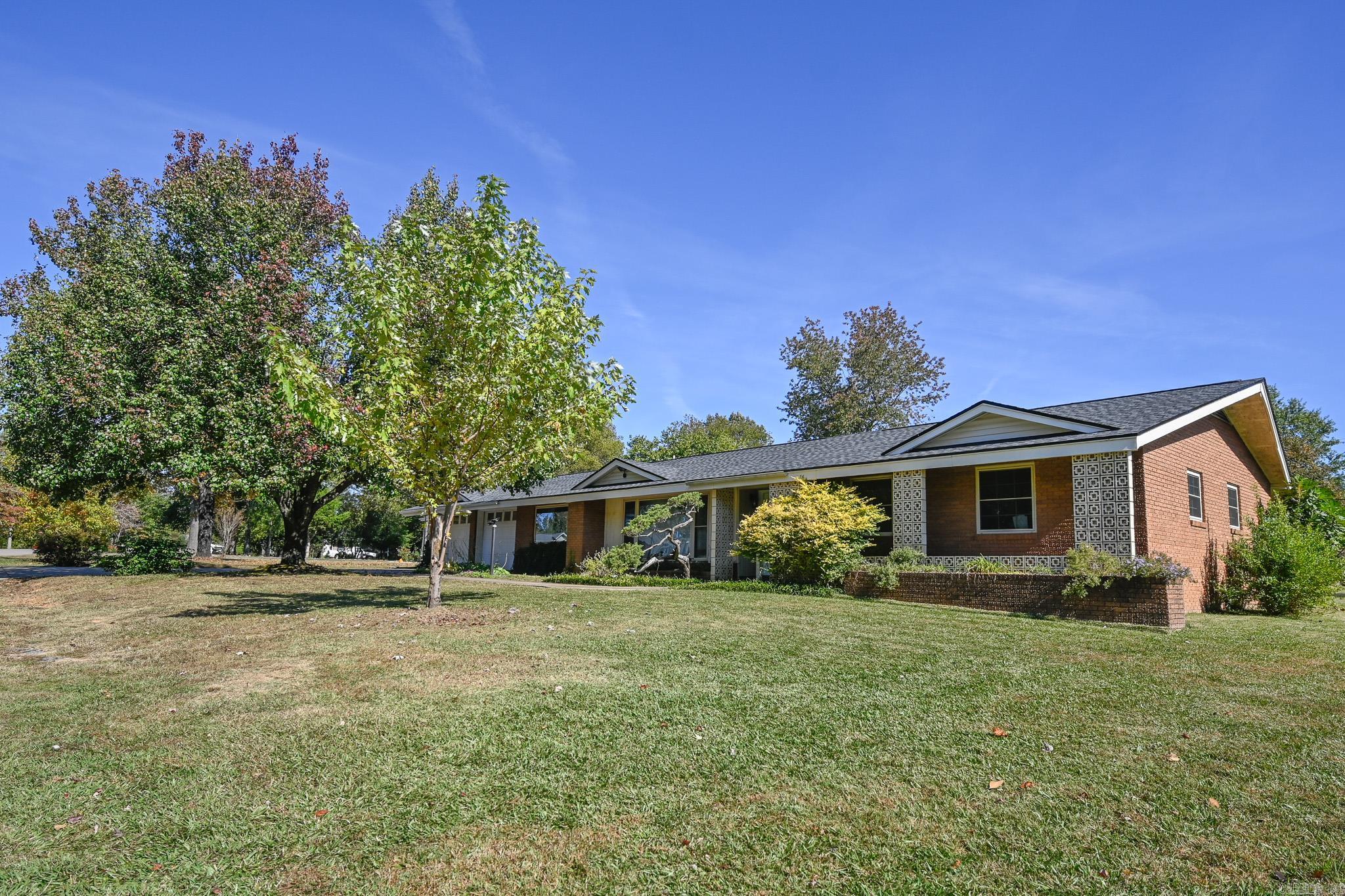 Welcome to this charming ranch-style brick home with timeless appeal and durability that offers comfort, space, and flexibility. The thoughtfully designed residence features a versatile floor plan with 5 bedrooms and 3 full bathrooms, providing ample space for family and guests. The double-sided electric log fireplace offers a warm atmosphere in both the living and dining areas. Many modern upgrades have been made to the kitchen, butler pantry, and bathrooms, plus a new roof was installed in 2025. The fenced and spacious backyard has a large deck for outdoor entertaining, space for gardening, and a storage shed to keep tools well organized. Nestled in a quiet, well-kept neighborhood, this home offers the perfect blend of tranquility and community. Enjoy nearby parks, schools, and local amenities, all within a short drive. Whether you’re looking for room to grow, space to gather, or a comfortable retreat to call your own, this inviting ranch is ready to welcome you home.