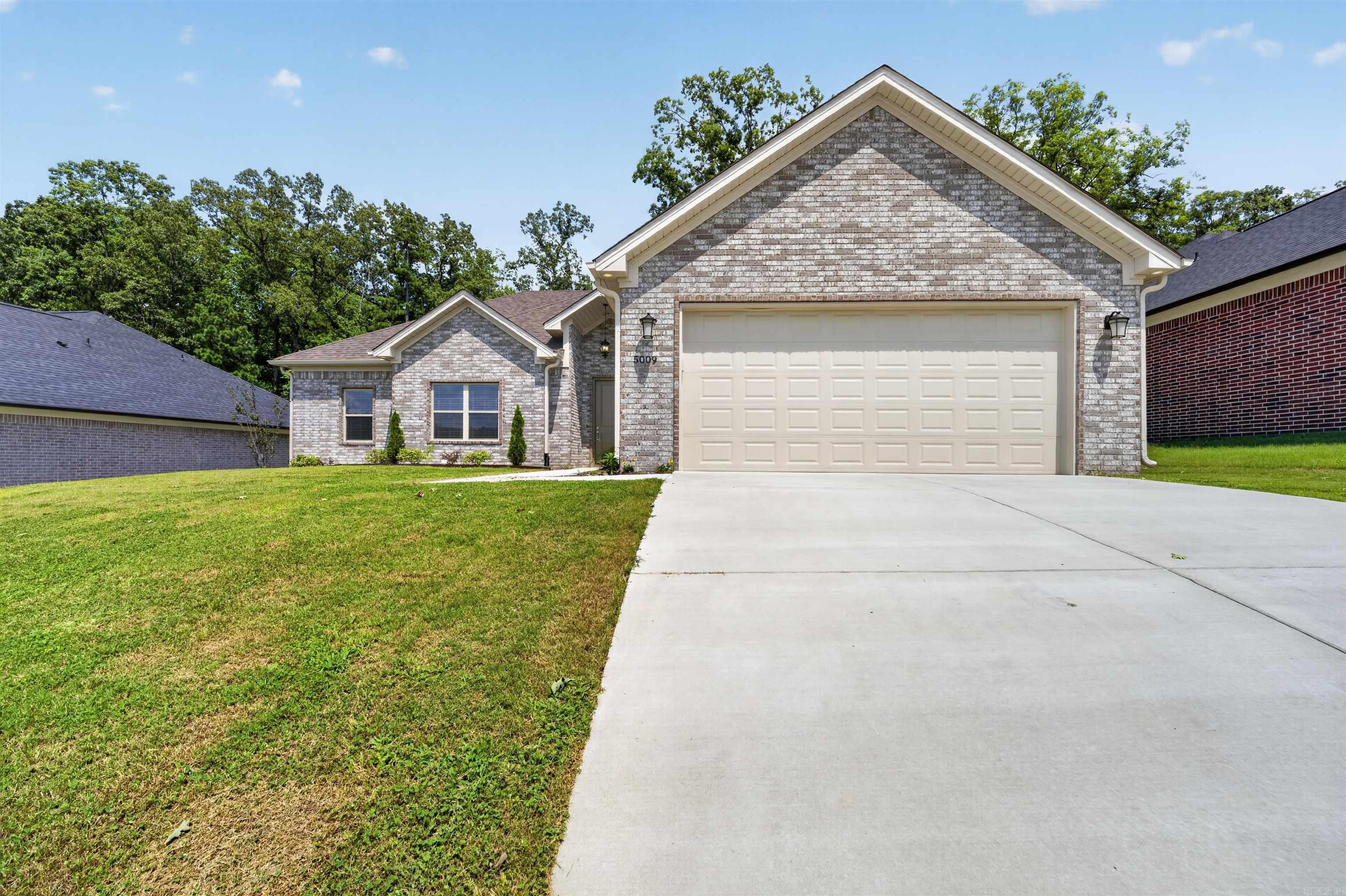 Discover the lifestyle you've been searching for in Bryant, Arkansas. This newer construction 4-bedroom, 2-bath, move-in-ready home combines modern design, energy-efficient features, and low-maintenance living in one of Central Arkansas' most desirable communities. Perfect for a first-time home buyer, growing family, or anyone looking to enjoy comfort and convenience, the open-concept layout is ideal for entertaining while the split-bedroom floor plan creates a private primary suite for relaxing at the end of the day. The kitchen features custom cabinetry, granite countertops, stainless steel appliances, a walk-in pantry, and designer lighting, all flowing seamlessly into the spacious living room with a cozy fireplace. Luxury vinyl flooring adds style and durability throughout the main living areas. Enjoy morning coffee or weekend gatherings on the covered back patio. Located in the highly sought-after Bryant School District, you'll have easy access to shopping, dining, parks, walking trails, medical facilities, and I-30 for a quick commute to Little Rock. Experience the quality of life that makes Bryant one of Arkansas' premier places to call home.