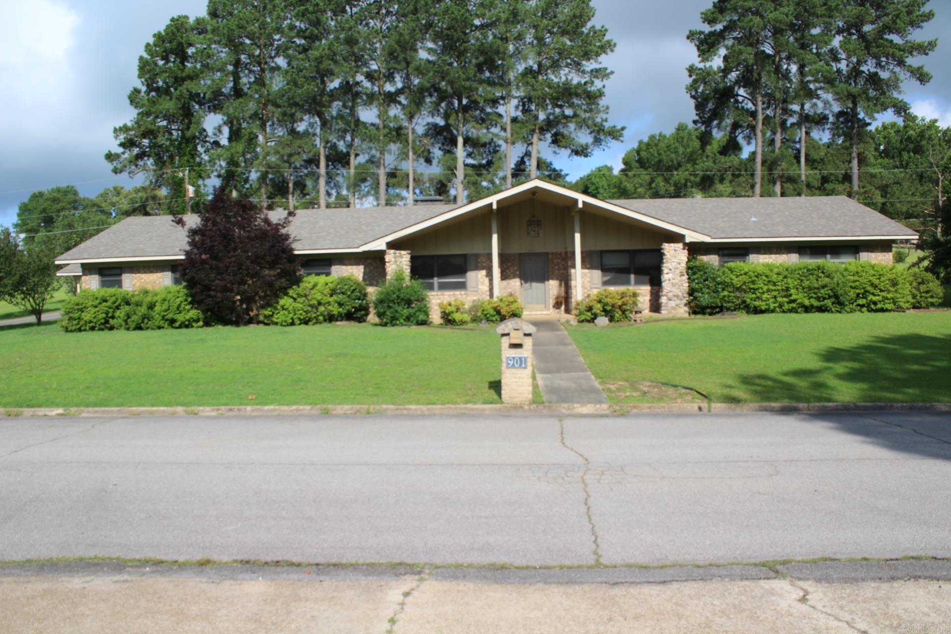MOVE IN READY 4 BEDROOMS, 2.5 BATHS with approx. 2791 Sq. Ft. of living space situated on approx. .63 acres in the heart of Nashville. Large kitchen with great storage space, granite (Range, refrigerator, washer & dryer to convey with sell of Home).  Large family area features beamed ceilings, wood burning fireplace.  Master bath features double sinks.  Central A/C & Heat only 2 years old.  2 car attached garage and a detached 2 car carport. Roof is only 3 years old.  Property has auto lawn watering system.