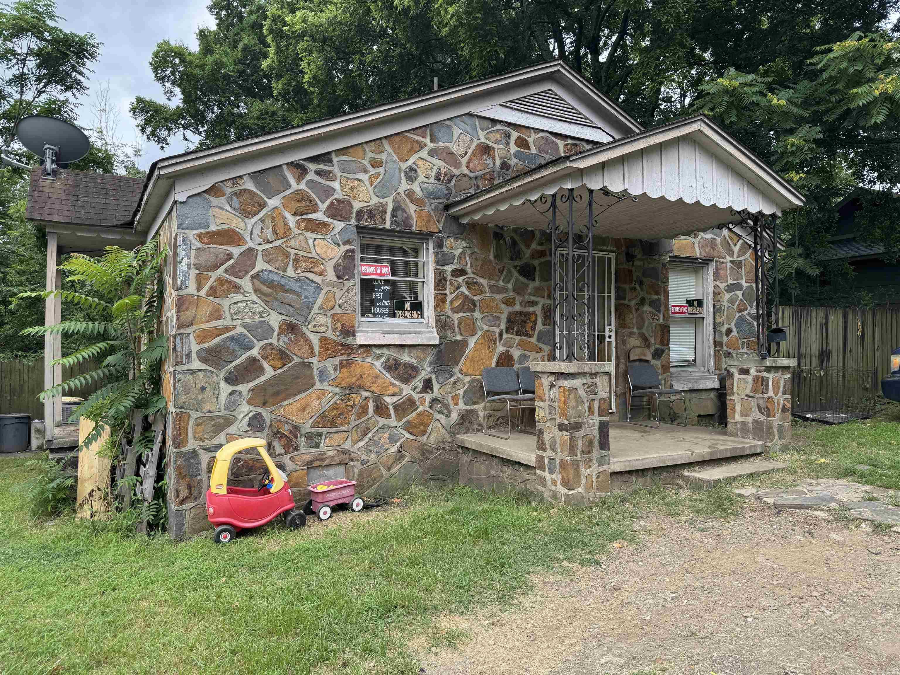 Beautiful rock exterior home located near the end of 18th Street, offering comfort and character. The home features 2 spacious bedrooms connected by a Jack-and-Jill bathroom, a welcoming eat-in kitchen, and a nice sized living room perfect for relaxing or entertaining. Home is move in ready but could use a little TLC.  Step outside to enjoy the privacy-fenced backyard, providing a great space for outdoor activities, pets, or quiet evenings at home.  This cozy home combines functionality, comfort, and privacy, making it an excellent place to call home.