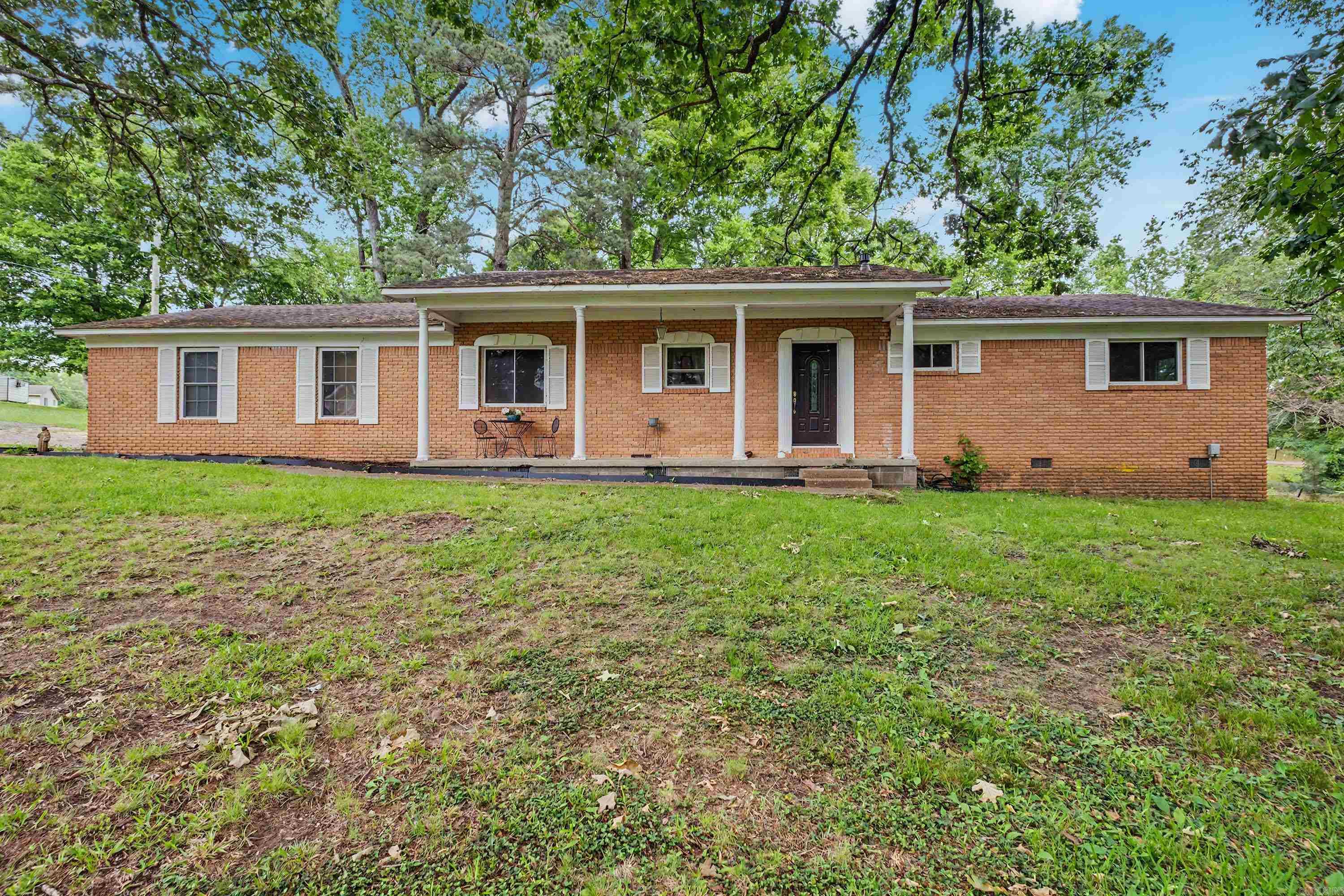 Rare opportunity to own nearly 3 acres inside Benton city limits! Situated on approximately 2.86 acres, this well-maintained home offers the space, privacy, and flexibility that are becoming increasingly difficult to find. Featuring 3 bedrooms, 2 bathrooms, and approximately 1,682 square feet, the home showcases hardwood flooring throughout much of the living space, generous storage, and a functional layout designed for everyday living.    Step outside and discover the true value of this property. Whether you’ve dreamed of building a workshop, adding a guest house, creating a hobby farm, or simply enjoying room to spread out, the possibilities are endless. The expansive acreage provides a rare combination of country-style living with the convenience of being just minutes from schools, shopping, dining, and everything Benton has to offer.    Properties with this much usable land inside the city limits rarely become available. If you’ve been searching for space, opportunity, and a place to make your own, this is one you won’t want to miss.
