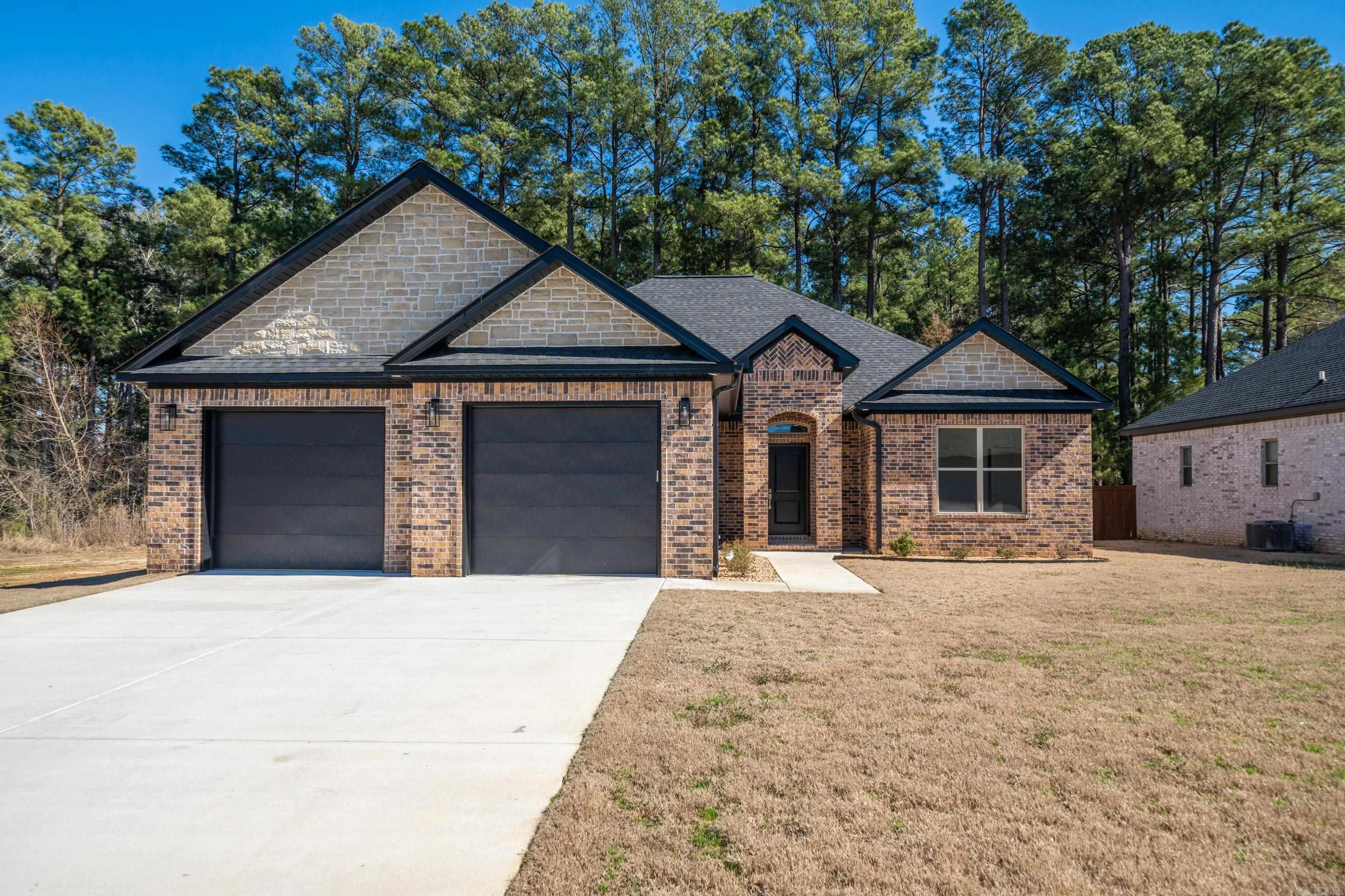 BEAUTIFUL NEW CONSTRUCTION located within Sheridan's highly sought-after Legacy Pointe Subdivision! This open concept home features luxury vinyl floors throughout, a separate laundry and mudroom, and stainless steel appliances. The large primary suite has walk in closets, a freestanding soaking tub, and an oversized tile shower.  Back yard is fully fenced and has an oversized covered patio. The neighborhood entrance is soon to have 2 functional gates, as well as a brick wall for privacy.    This home qualifies for Rural Development loan programs, which means you can own for no money down!  Come see this beautiful home and make it yours today!