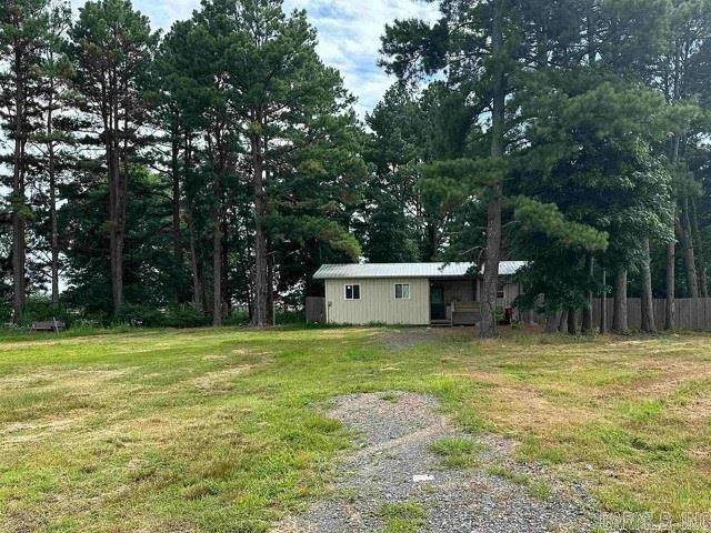 Attention Investors! Here's an affordable opportunity to add a cash-flowing property to your portfolio. Situated on 1.11 level acres with mature trees and a fenced yard, this 2024 mobile home offers 560 sq. ft. of efficient living space featuring 1 bedroom, 1 bath, vinyl flooring, metal roof, paneling, and an open kitchen, living, and dining area. A long-term tenant currently resides in the home, providing immediate rental income potential from day one. Enjoy the appeal of country living with the convenience of being only about 20 minutes from everyday amenities, shopping, and dining. The property is served by public water and septic and offers plenty of outdoor space for tenants to enjoy. Whether you're looking to start investing, expand your rental portfolio, or secure an affordable income-producing property, this is a smart opportunity at an attractive price point. Don't miss your chance to own a newer home with built-in rental potential!