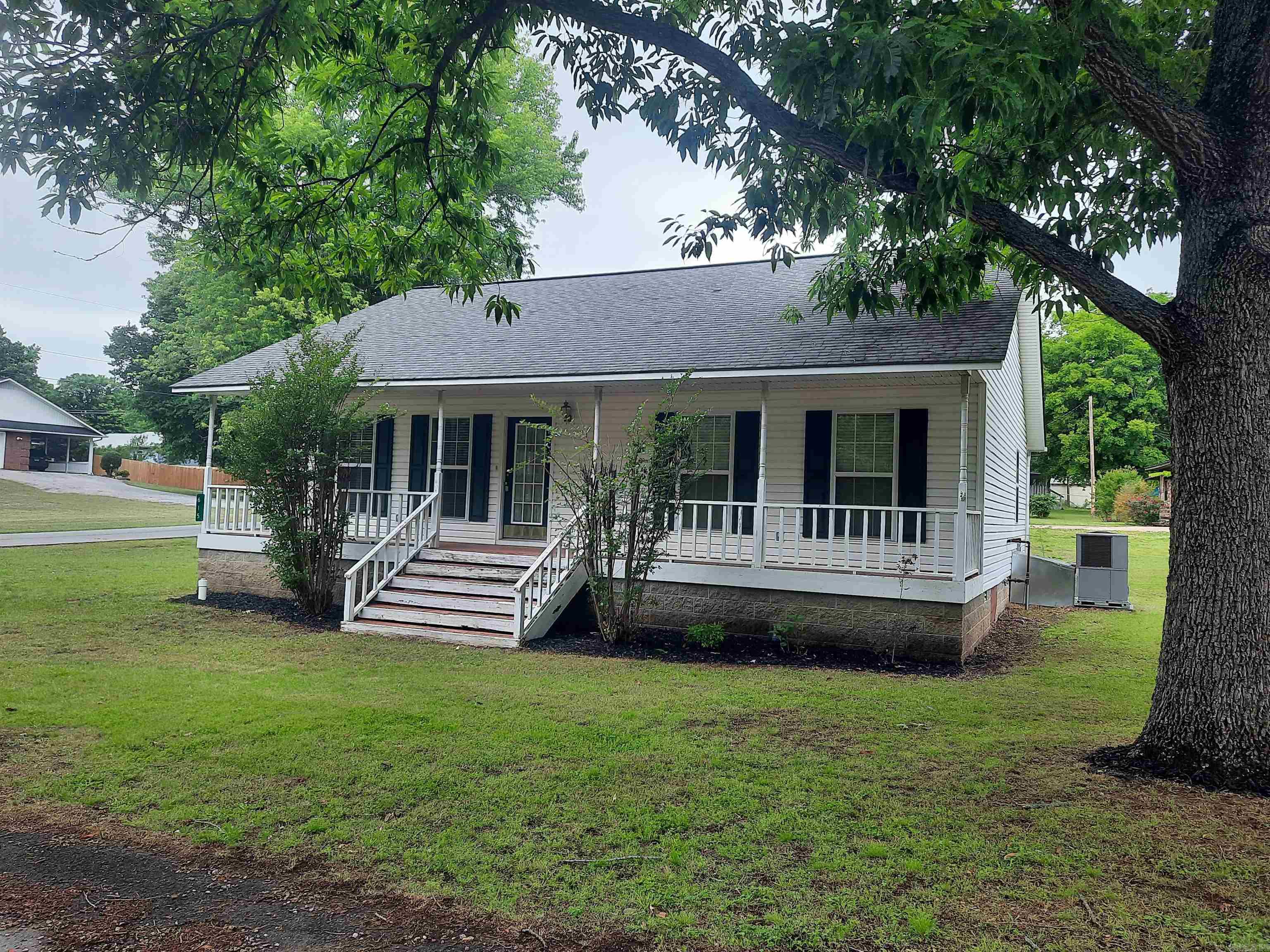 With-in walking distance of the famous Court Square, music, shopping, and several restaurants to choose from, that is where you will find this charming 3-bedroom, 2-bath home. This home offers low maintenance, inside and out, large inviting front porch, back deck, attached 2 car garage, and did I say location is great.  If you are looking for a get-away, full time home, or investment property, take a look.