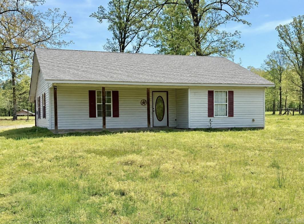 This 3-bedroom, 2-bath home sits on 2.18 acres, offering privacy and a quiet rural setting. Conveniently located just a short drive from town, this home would make a great starter home or an excellent option for those looking to downsize while still enjoying space and privacy. The property provides plenty of space for outdoor activities, gardening, or simply relaxing in a fully fenced in yard.  A storage building is also included, offering additional space for tools, equipment, or hobbies.