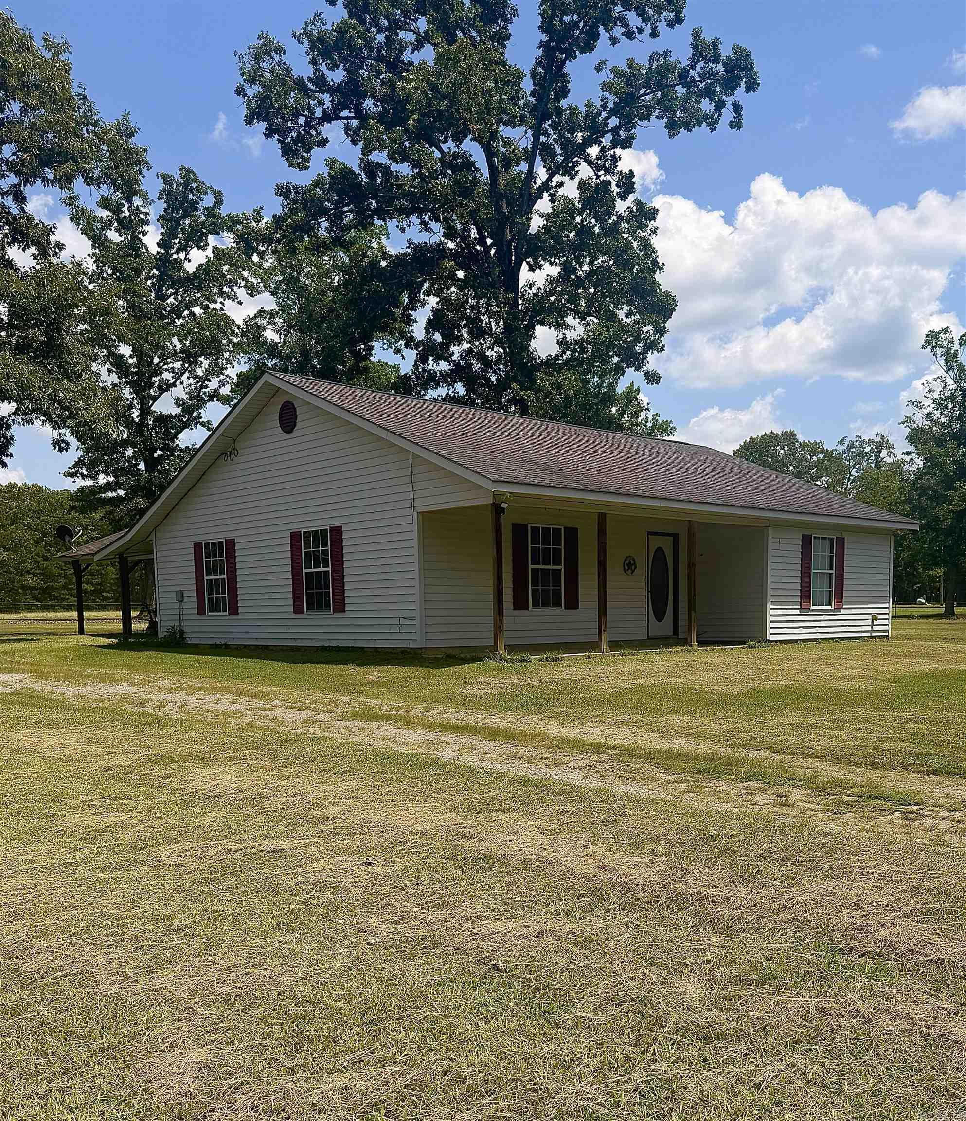 This 3-bedroom, 2-bath home sits on 2.18 acres and is fully fenced in!  The property offers privacy and a quiet country setting. Conveniently located just a short drive from town, this home would make a great starter home or an excellent option for those looking to downsize while still enjoying space in Cleveland County.  A storage building is also included, offering additional space for tools, equipment, or hobbies.