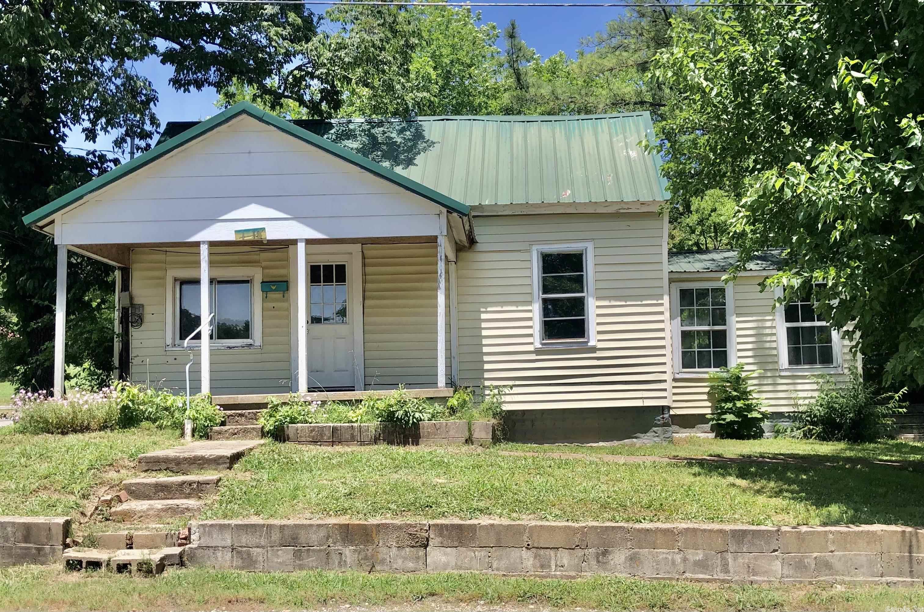 This 769sqft fixer upper being sold "AS IS" has great potential!  1 bd, 1 ba with yard space to add on,  the property is located on a corner lot with a nice size back yard, 2 car carport & large metal storage shed in the heart of Pocahontas. A great property for rental or a small family.