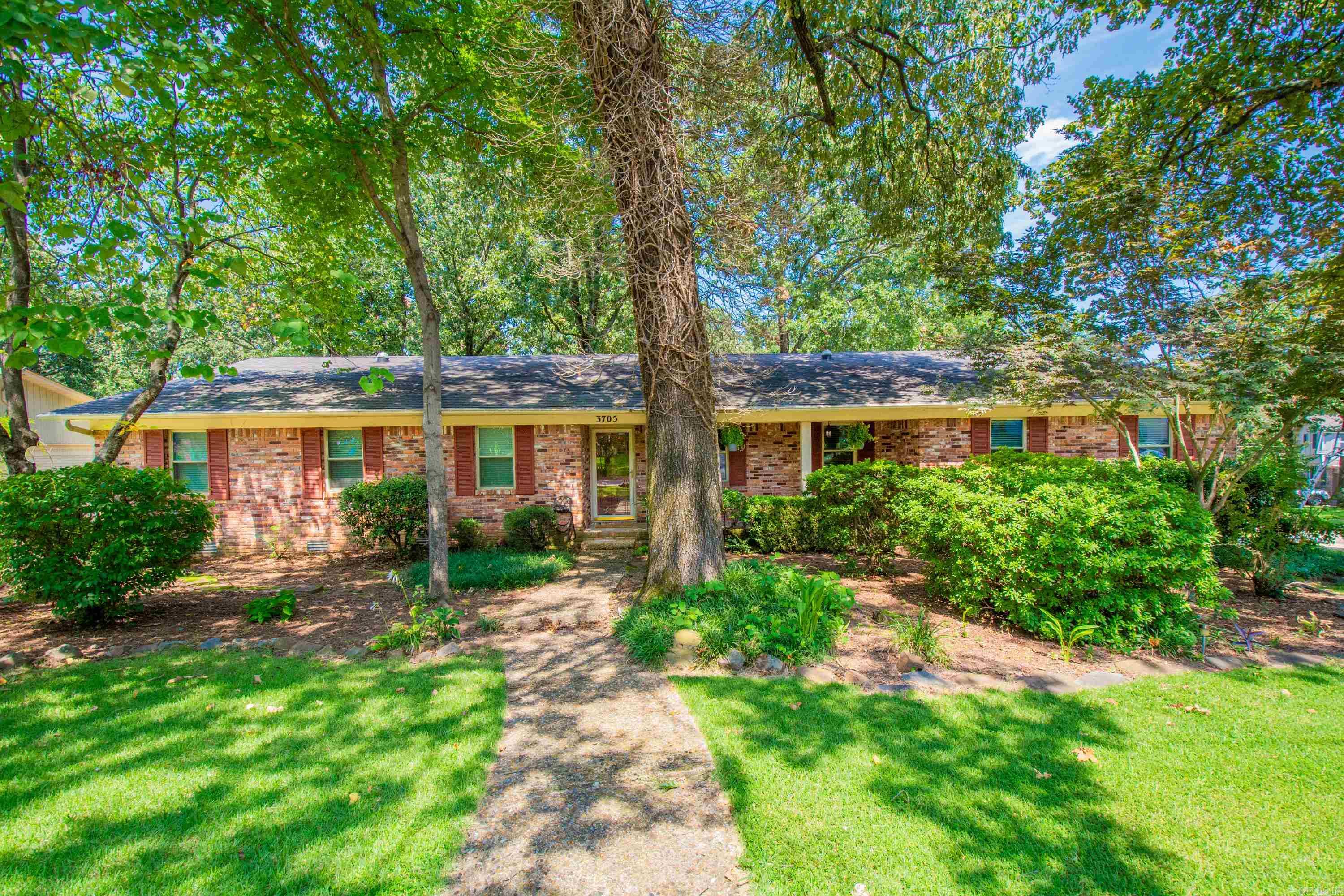 Remarkable Lakewood home with an inviting open floor-plan. The interior boasts 2 living areas. One formal front-entry living room with new carpet and a cozy family room with wood-burning fireplace. All open to a spacious dining room and kitchen with breakfast bar-tops. Stainless appliances, gas range, separate vegetable washing sink, new Bosch dishwasher last year, loads of cabinet space, beautiful wood ceilings with recessed lighting. Lots of improvements in 2011 include: Roof, vinyl windows, cylinder skylights, attic insulation, sewer line replaced. Additional extras:  tankless water heater, sprinkler system, solar powered attic ventilation, in-ground pool, refurbished wood deck. New HVAC and ducting a few years old. Hall bathroom updated with paint, flooring, vanity, mirror, lighting, and subway tiled shower. Large master bedroom with sitting area, double closets, and dual sink vanity. Lots of recessed cabinet storage. Beautiful backyard that is perfect for the love of outdoor living. In-ground pool, wood deck, extra concrete decking patios to set up multiple seating and outdoor dining areas. Extra landscaping and fully privacy fenced on huge corner lot. See Agent Remarks.