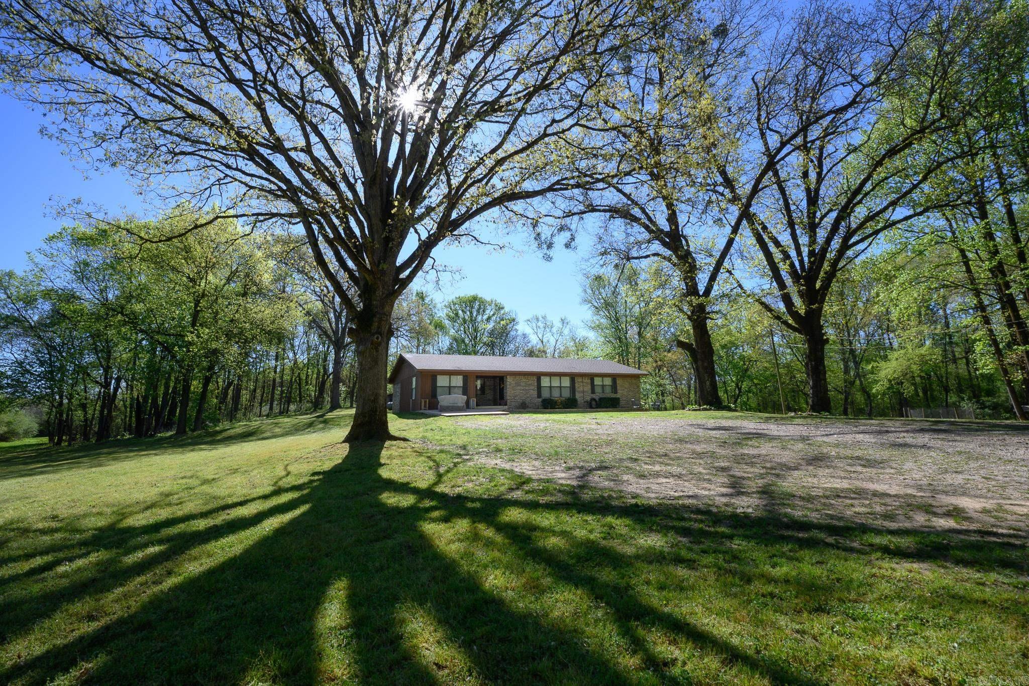 Located just a short drive from Mena’s shopping, restaurants, and everyday conveniences, this beautifully updated home gives you the best of both worlds, close enough for easy living, but far enough out to enjoy the peace and privacy of the country. Set on approximately 18 acres, this 3-bedroom, 2-bath home offers a warm, inviting feel with tasteful updates that include remodeled bathrooms and laundry room, and a newer roof. Inside, you’ll find an open living area, laminate wood floors, and a layout that feels both comfortable and functional for everyday life. Outside is where the real opportunity begins. With 18 acres of usable land, you have a true blank canvas to create the kind of setting you’ve always wanted, whether that’s a park-like retreat with mature trees and open space, a hobby farm, or the homestead you’ve been dreaming about. The peaceful country setting, large yard, and included storage building give you room to spread out and make it your own, all while enjoying the freedom and versatility that acreage this close to Mena offers, but is so hard to find!