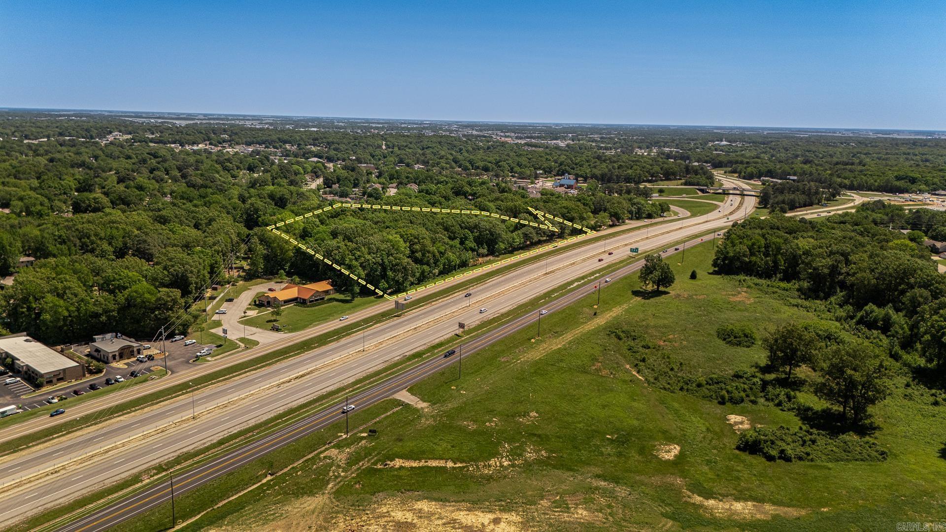 5.45-acre C-3 Commercial tract located at 2620 Alexander Drive in Jonesboro, Arkansas, just off Highway 555. Positioned along an access road with convenient ingress and egress, this property offers strong accessibility and exposure near a major traffic corridor. The site features generally level, usable land well-suited for development. C-3 zoning allows for a wide range of commercial uses including retail, office, and service-based businesses. Located in a growing area with nearby residential and commercial activity, this property presents an excellent opportunity for development or investment. Utilities are available nearby.