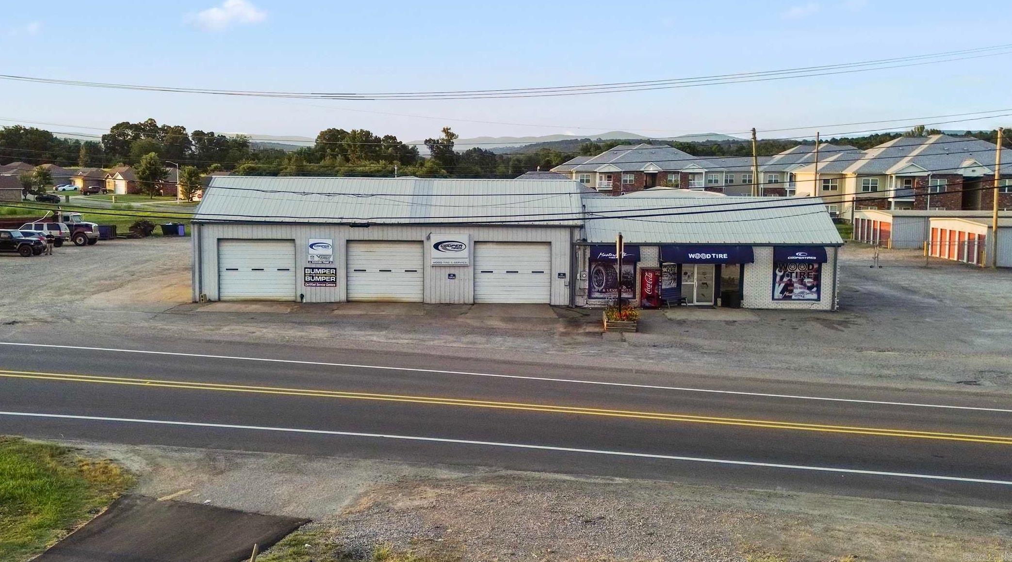 Seize this rare opportunity to own a thriving tire and service center in the heart of Clarksville, Arkansas. Property offers highway frontage, 10,000 sq. ft. of well-maintained space, featuring 7 bays, a waiting area, restrooms, multiple offices, and a spacious attached apartment. The property sits on a generous 1.20-acre lot, providing ample room for expansion or additional services. Business, land, and building are included in this sale. Don’t miss out! Contact the listing agent for more details and to schedule a showing.