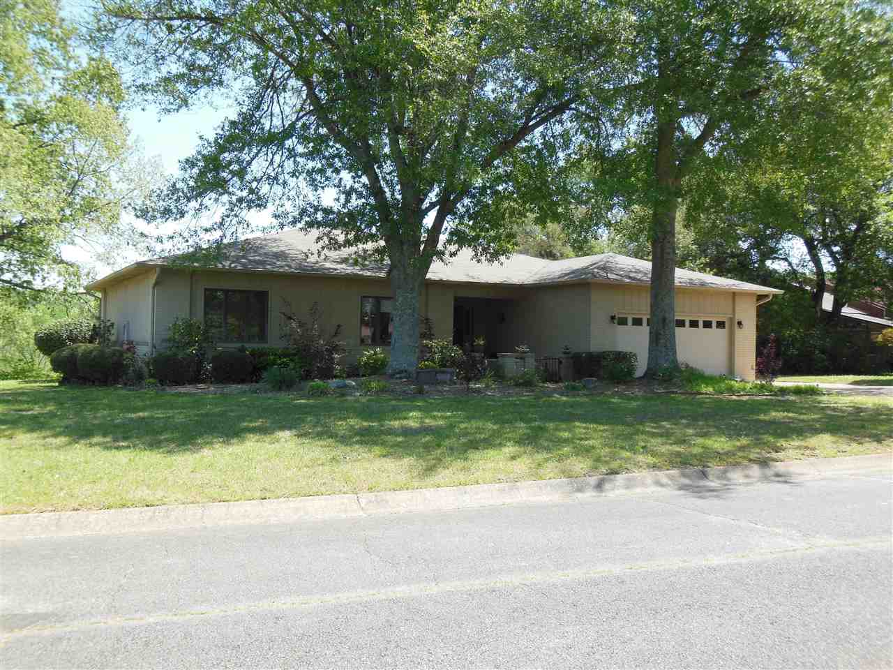 Say Hello To A Good Buy! This home features include a large deck overlooking a serene view! Also included are hardwood floors, a wet bar, gas log fireplace, stainless appliances, and much more. Located just minutes to downtown and Hot Springs Village.