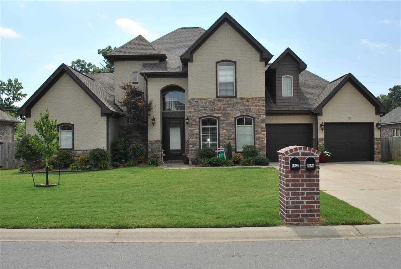 This beautiful home is loaded with custom features from the tall ceilings to the remote window coverings.  The formal dining room located right off of the kitchen will be the perfect place to entertain friends or family.  The living room features an electric log fireplace with mantel and is very spacious.  Enjoy family time on the large covered back deck.  The Master Bathroom will take your breath away with the tilled shower, Jacuzzi tub and oversize vanity with his and her sinks.