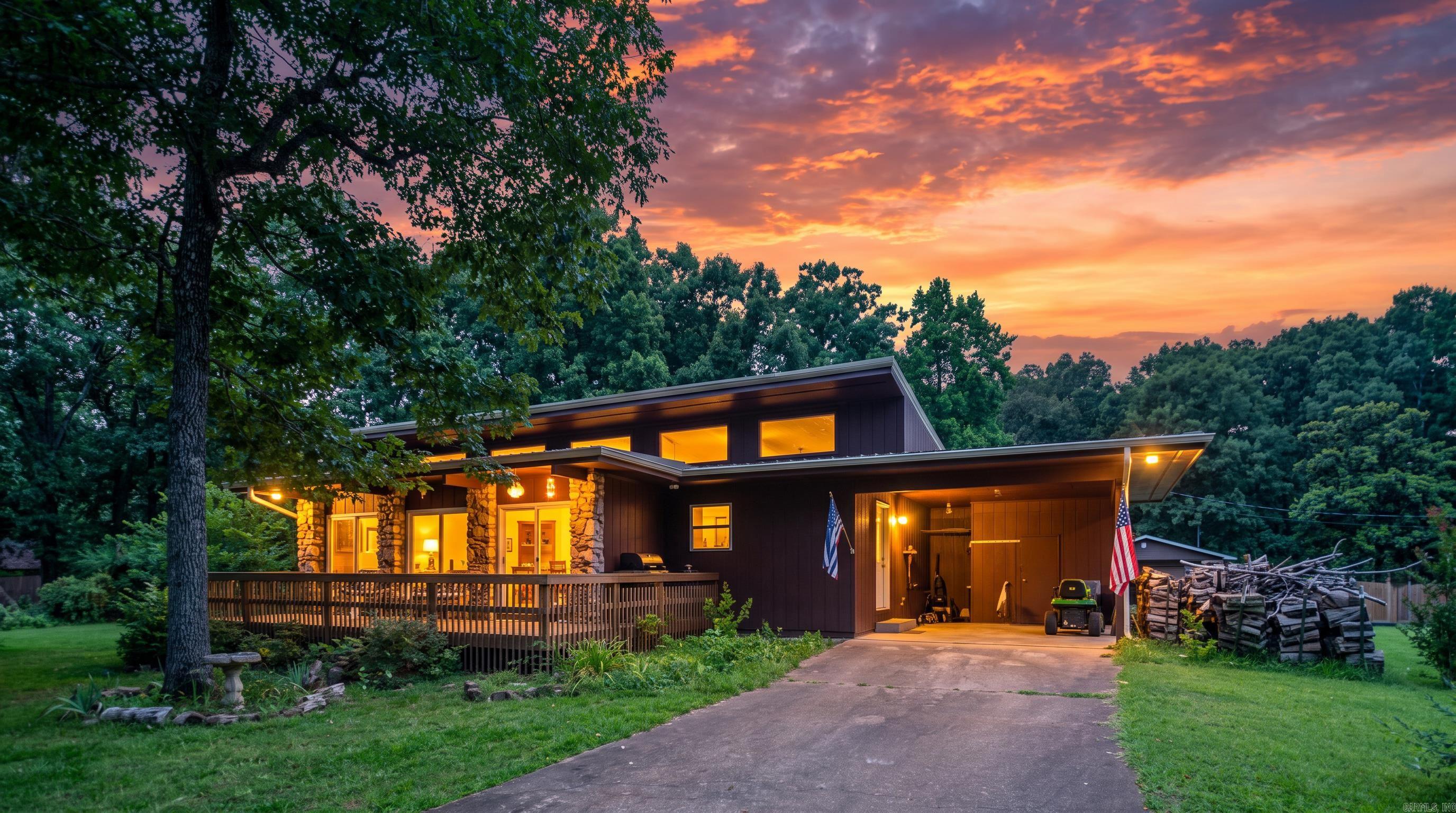 Country Home in Cherokee Village | Income-Producing Opportunity  Whether you're searching for a full-time home, weekend retreat, or investment property, this charming 2-bedroom, 1-bath home in Cherokee Village offers exceptional versatility. Currently operating as a successful Airbnb, it provides immediate income potential. Offering approximately 1,112 square feet, the home features spacious bedrooms, a large bathroom with a custom stone-floor shower, and a kitchen with ample counter space and washer/dryer conveniently located near the attached one-car carport. The inviting living room showcases a custom rock fireplace and opens to the dining area with upper windows for abundant natural light. A storage room off the carport provides extra space for tools and lawn equipment. Situated on approximately 1 acre, the beautifully landscaped yard features mature pine, oak, and cedar trees, a young weeping willow, elephant ears, a raised garden bed, and a fenced backyard with room to expand. Enjoy easy access to Cherokee Village's seven lakes, two golf courses, parks, shopping, and dining.