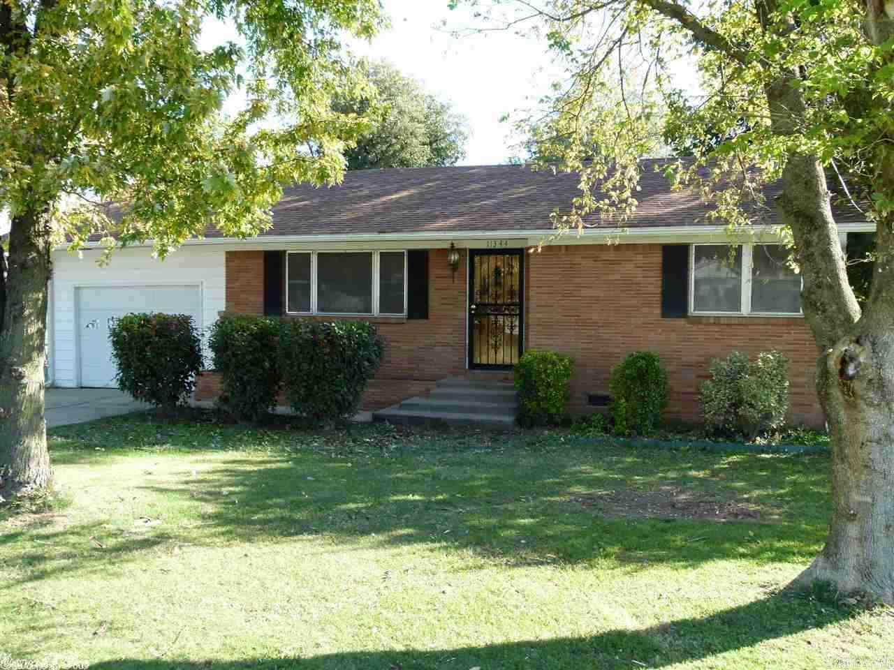 Great starter home! This all brick home has a new AC/Heat unit. All new paint and baseboard trim in bedrooms and living room. The unit is electric cool and gas heat. It is on a large corner lot with lots of good shade trees. The extra concrete parking pads along driveway makes it easier for family and friends visiting. The property has a large storage building. Call for your showing!