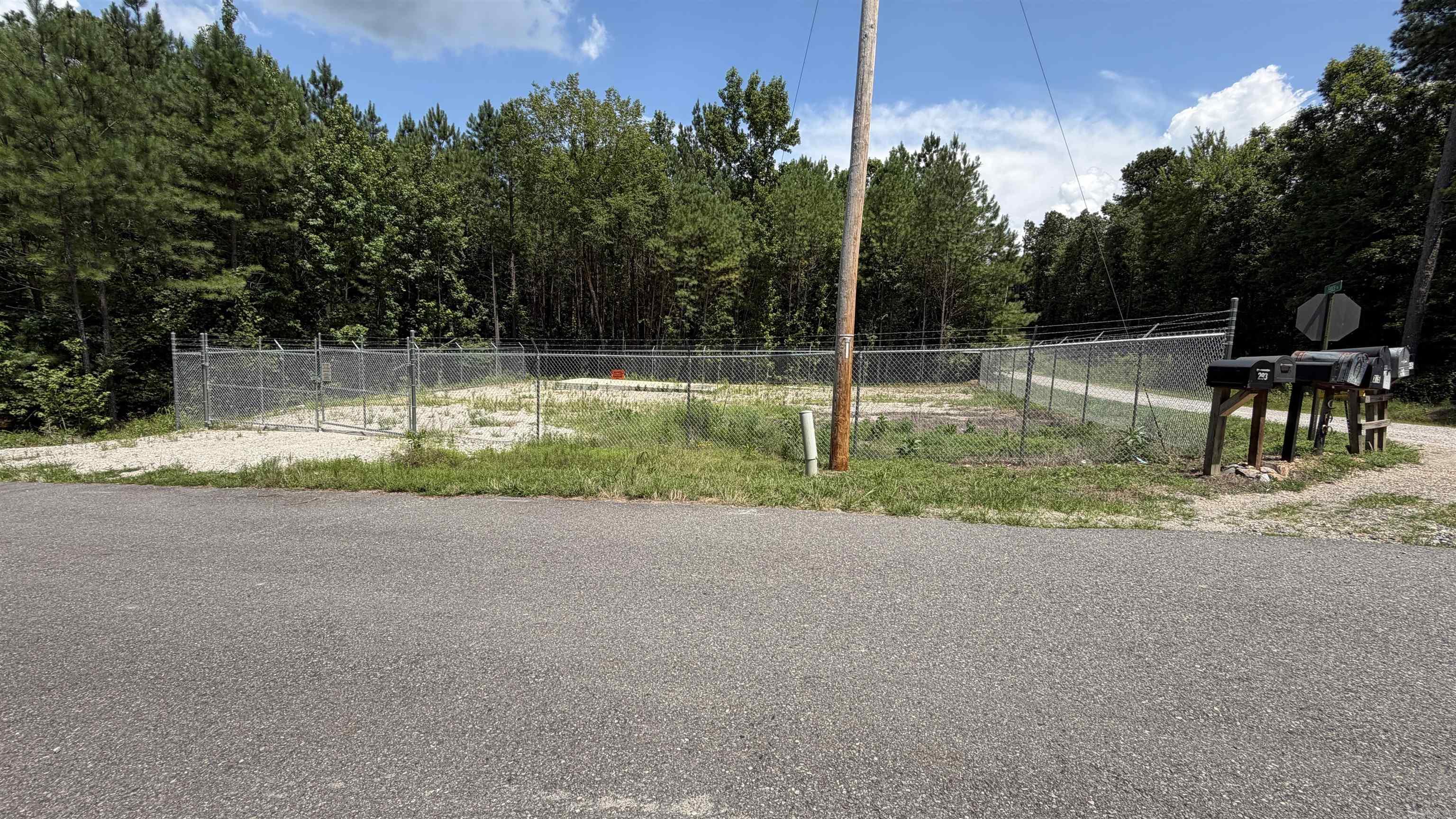 Initially purchased and developed to house a future fiber optics hub. The property is on a corner lot of Fence Rd and Cam Lane. Utilities appear to be available at the road. Survey done August 2023 at initial purchase
