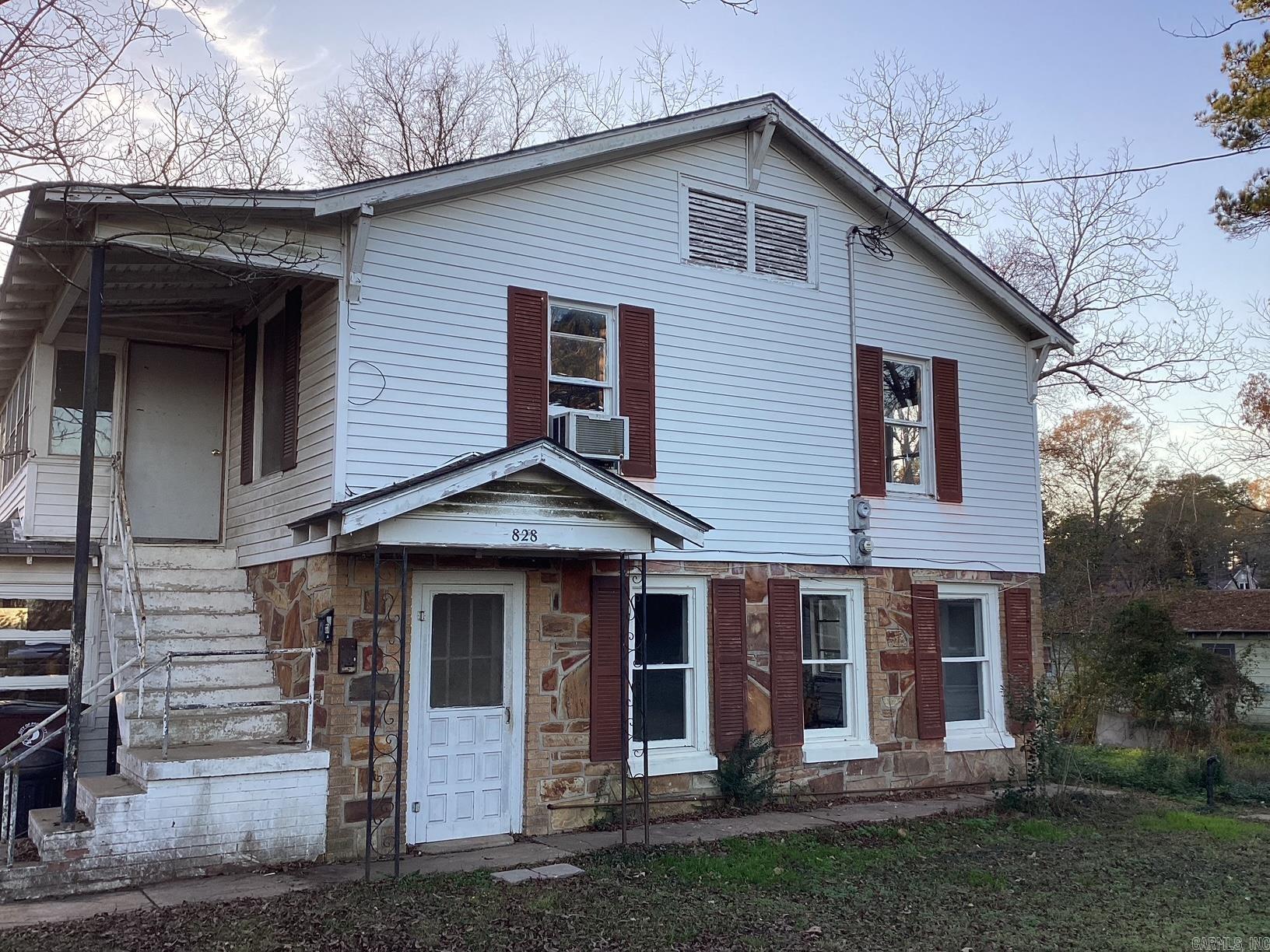 Two-story duplex in Prescott, Arkansas offering a great opportunity for investors or buyers looking for a renovation project. This fixer-upper features two separate living units and plenty of potential to customize or modernize. With repairs and updates, this property could serve as a long-term rental, multi-family investment, or resale opportunity. Plenty of parking around the building with a concrete slab for outdoor grilling. Within walking distance to Kofield cafe. 2 bedrooms and a bathroom upstairs, 2 bedroom and a bathroom downstairs. see agent remarks