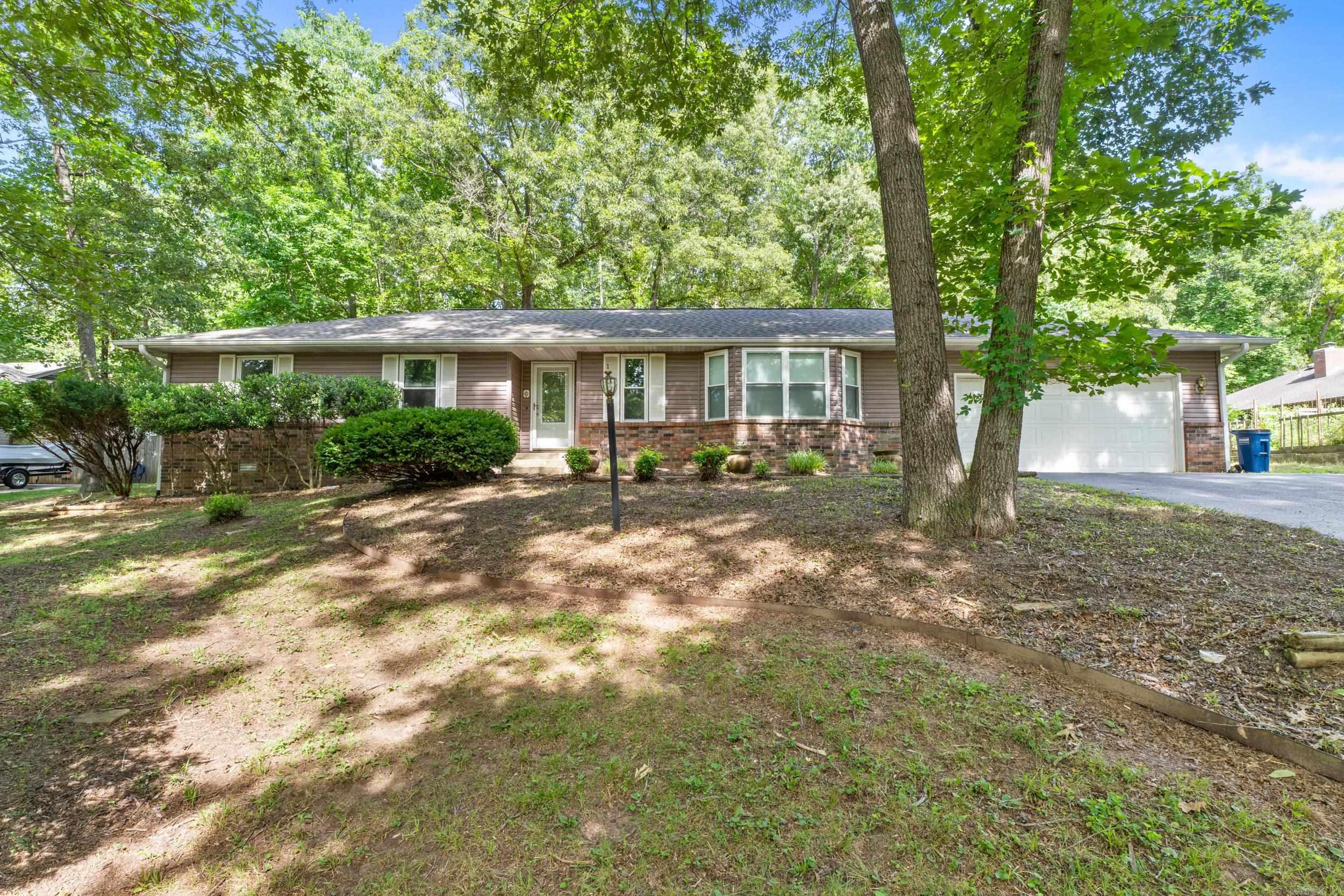 Move-in ready and beautifully updated, this 2-bedroom, 2-bath home is located in the desirable Pebble Creek subdivision just off the Mountain Home Bypass, offering convenience and a great neighborhood setting. Recent updates include attractive vinyl plank flooring, fresh interior paint, and a well-maintained interior that reflects pride of ownership throughout. The spacious living areas provide comfortable everyday living, while the attached 2-car garage offers ample storage and parking. Step outside to enjoy the large backyard shaded by mature trees, perfect for relaxing, entertaining, or gardening. An open patio provides additional outdoor living space, and the storage building is ideal for tools, hobbies, or extra storage. If you’re looking for a well-cared-for home in an established neighborhood close to shopping, medical facilities, and schools, this property is a must-see.