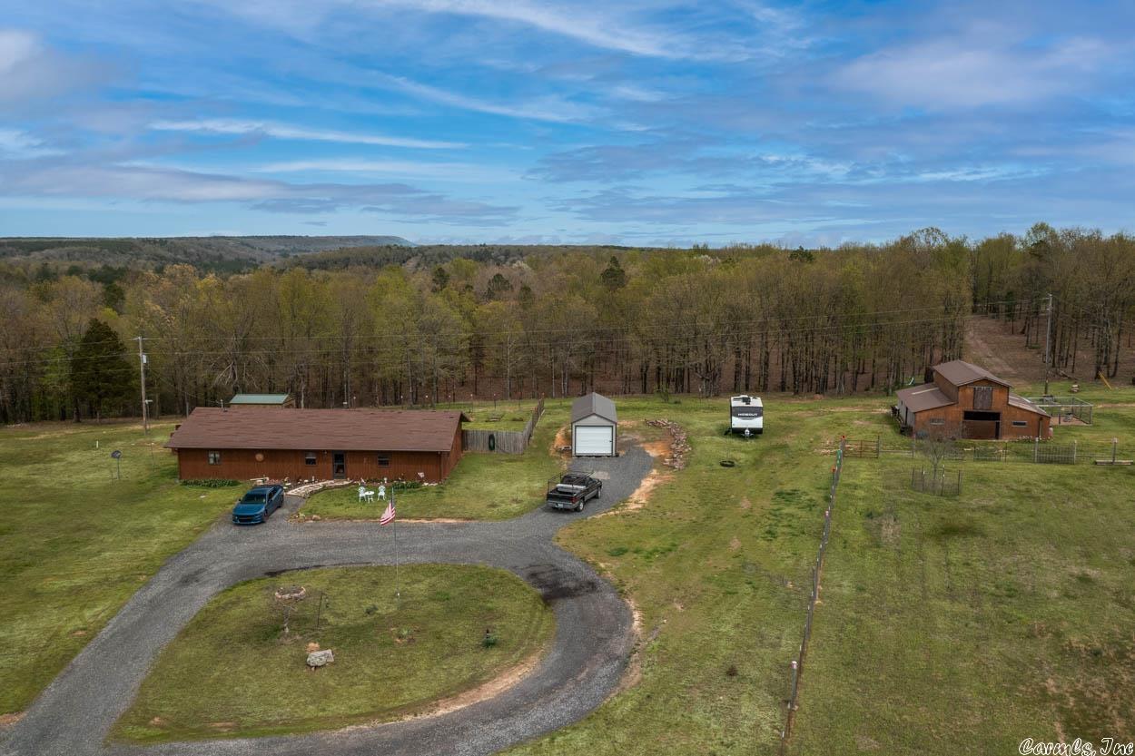 Looking for a beautiful, spacious home surrounded by nature? Look no further than this stunning ranch-style home situated on 32 acres of scenic land!  As you step inside this charming home, you'll be greeted by a warm and inviting atmosphere. With 3BR/2BA + office, and an open-concept living and dining area, there's plenty of room for everyone to spread out and make themselves at home. Comes with solid surface counters & a Ben Franklin Wood Burning Stove. Has two water heaters and comes with 32x15 Half covered deck, barn is 32x36.  But the real star of the show is the land outside. Whether you're an outdoor enthusiast or simply love to take in the beauty of nature, this property has something for everyone. The 32 acres of land provide ample space for hiking, biking, horseback riding, hunting and more. It has a small off-grid hunting cabin with a deck with an amazing view at the back.  You'll love relaxing in your wooded paradise and taking in the stunning views of the surrounding countryside. $3000 flooring allowance offered!  Don't miss your chance to make this dream home a reality. Contact us today to schedule a viewing!Agents be sure to reference confidential remarks.