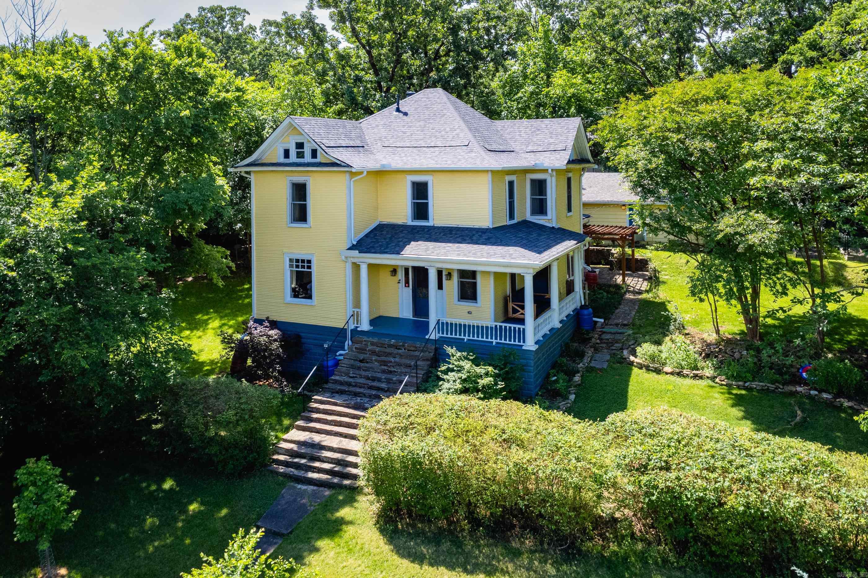 WONDERFULLY UPDATED HISTORIC HILLCREST HOME ON 3 LOTS, OVER HALF AN ACRE, OVERLOOKING ALLSOP PARK. An L shaped covered porch with a porch swing looks onto N Lookout and Allsopp Park and leads into the he main floor which has a great layout with three large rooms along with the entry, kitchen and full bath. The kitchen has been updated with new appliances and butcher block countertops. Both bathrooms on the main level and second floor were taken to the studs and completely updated. The second floor has three ample sized bedrooms with two that overlook Allsopp Park. Hardwood floors are found throughout the house. Being on three lots, the yard is very large, seeded, has new flower beds with native pollinators, many newly planted trees, plenty of space for a garden and extensive outdoor living. The interior was completely repainted. The exterior was completely scraped, some wood replaced and repainted along with gutters being added. New roof, all new electrical, new HVAC w/ Nest thermostats, new historically energy efficient windows and plumbing updates. Large driveway for parking along with a 484 square foot two car garage.