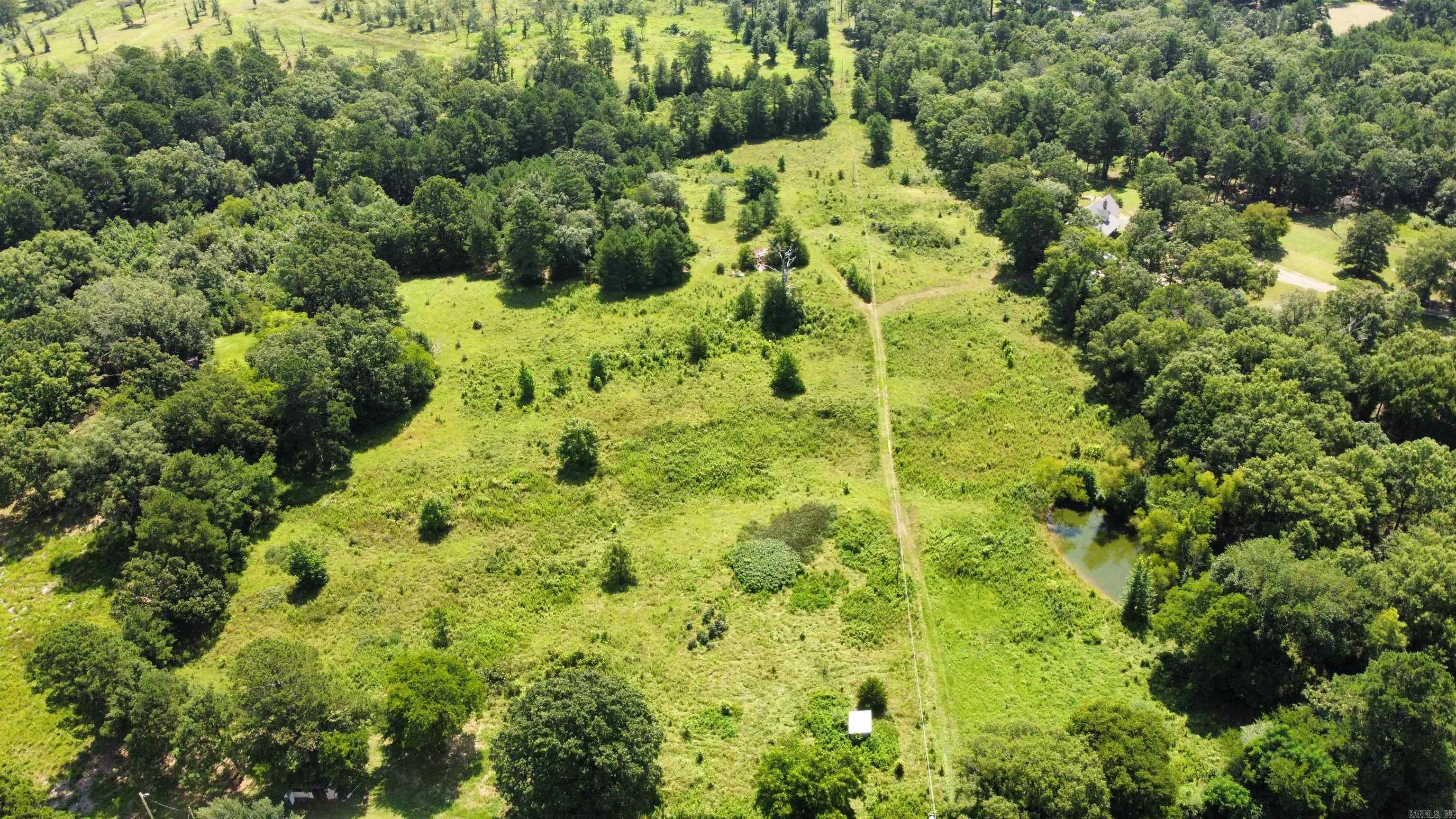 Welcome to your blank canvas in Hot Spring County! Located at 334 Highway 347, this beautiful 15.35-acre parcel offers the ultimate rural escape. Whether you are looking to build your dream homestead, park an RV, start a small hobby farm, or simply invest in land, this property is ready to accommodate your vision. A survey has already been completed on the property, giving you immediate clarity on your boundaries so you can start planning your build right away. Enjoy the slow pace of rural life without losing touch—you’re just minutes from local Bismarck schools and a quick drive to the waters of DeGray Lake or the shopping and dining in Hot Springs. Grab your boots and come take a look at where your next chapter begins.