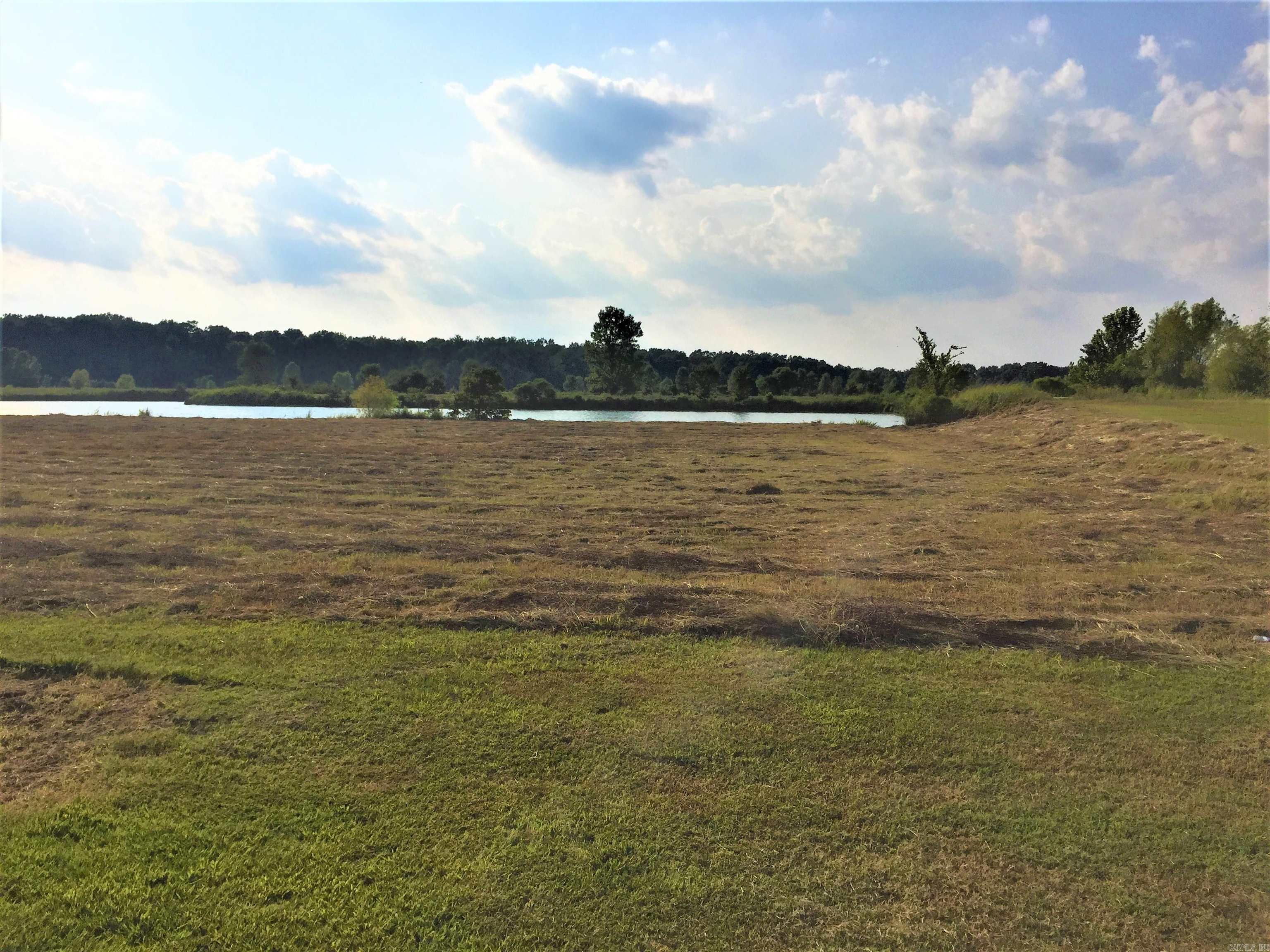 Come on out, and get a glimpse of what Lake life is all about. Lots big enough for the avid gardener and a Lake stocked for the avid fisher. Who doesn’t love from lake-to-table, from garden-to-table. Mound Lake Estates is a true hidden gem gated community, where everyone waves. An out of city limits feel but still a close commute to necessities. Restaurants, shopping, and grocery can easily be a 20-25 minute commute to North Little Rock, and about 15 minutes to England. Little Rock AFB about a 25 minute commute. Major distribution centers such as Lowes, Dollar General, Amazon, and Caterpillar Inc. about a 20 minute commute. These Lots are level with gas, water, and electric available. Community sewer available or septic, you get to make the choice. Bring your Builder and house plans. Architectural committee to approve house plans. Mound Lake is accessed by a 150 foot boat ramp for adventurous fishing or just boating to relax and unwind. Please see Agent Remarks.