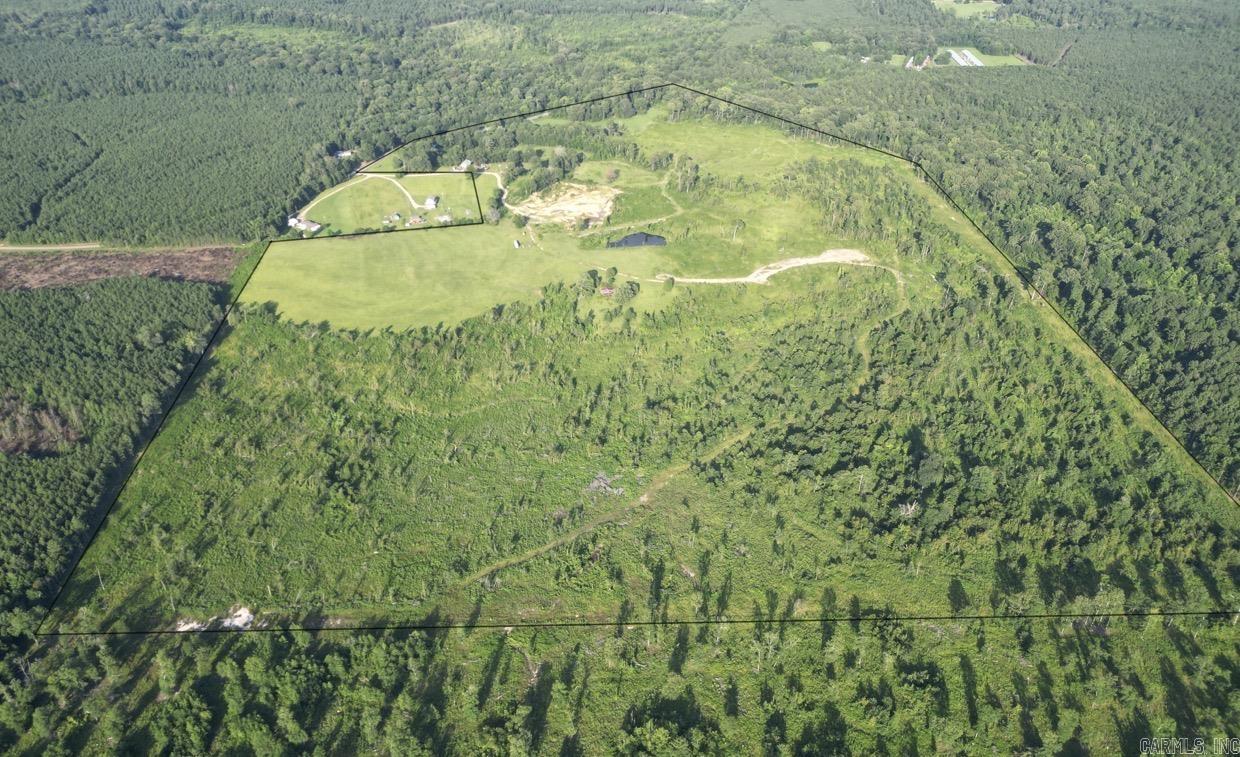 Whether you’re looking for a livestock operation, hay production, recreational hunting property, or investment opportunity, this 200.39+/- acre property is full of potential! The property features a 70’ x 40’ shop with power and electricity in place, an older barn, multiple ponds, two driveways, and highway frontage. Approximately 55 acres of beautiful pasture is ready for livestock or hay production. The remaining approximately 145 acres offers a mixture of clear-cut and wooded acreage, with approximately 30 acres of the clear-cut area sheared and free of stumps. Wood posts are placed approximately every 25 feet along three sides, making future fencing a possibility. Trails run throughout the property, with an approximately 50-yard-wide pushed perimeter. A smaller gravel pit with plenty of gravel remaining offers potential income opportunities. Wildlife includes whitetail deer, quail, and occasional wild hogs. A versatile property with endless possibilities!