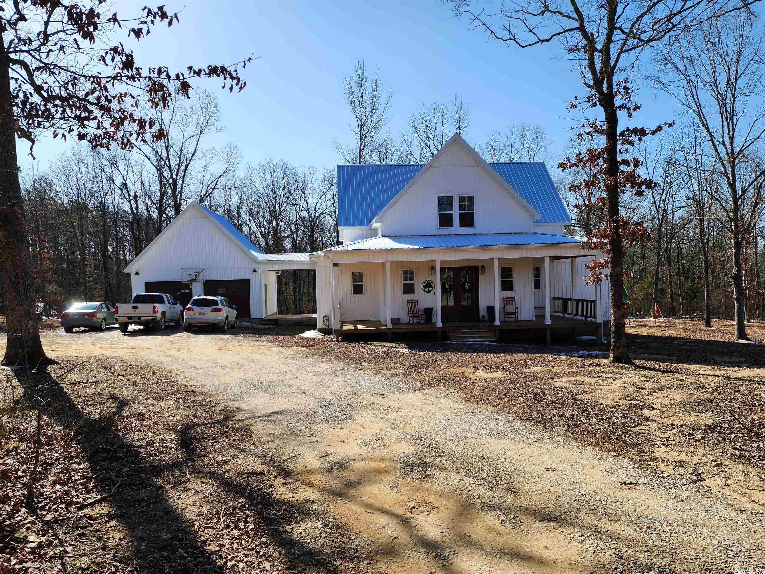 Welcome to this breathtakingly beautiful farm style home. Custom built in 2020, this awesome home boasts 1 master bedroom with bathroom on the main level with an open concept kitchen and living room, laundry room just off the kitchen, pantry and half bathroom. The kitchen is designed with open floating shelves, quartz countertops, all wood white shaker style soft close cabinets, porcelain farm kitchen sink and hardwood floors. In the living room there is a gas log fireplace as well as one on the back deck just off the living room. White wood walls accentuate the tons of natural light this home has and gives it such a warm and inviting feeling. Upstairs is 3 bedrooms all carpeted and 2 bathrooms. 1 bedroom has it's private bathroom while the other bath is shared. This house was skillfully designed with huge closets and tons of extra storage space. All bathrooms are tiled as well. Outside you will find a very nice front porch and a back deck. The double car garage is detached with a covered walkway to the house. Inside Dalton Estates you will enjoy your own private landowners only lake that is excellent for fishing! There is too much to list so you MUST SEE IT!