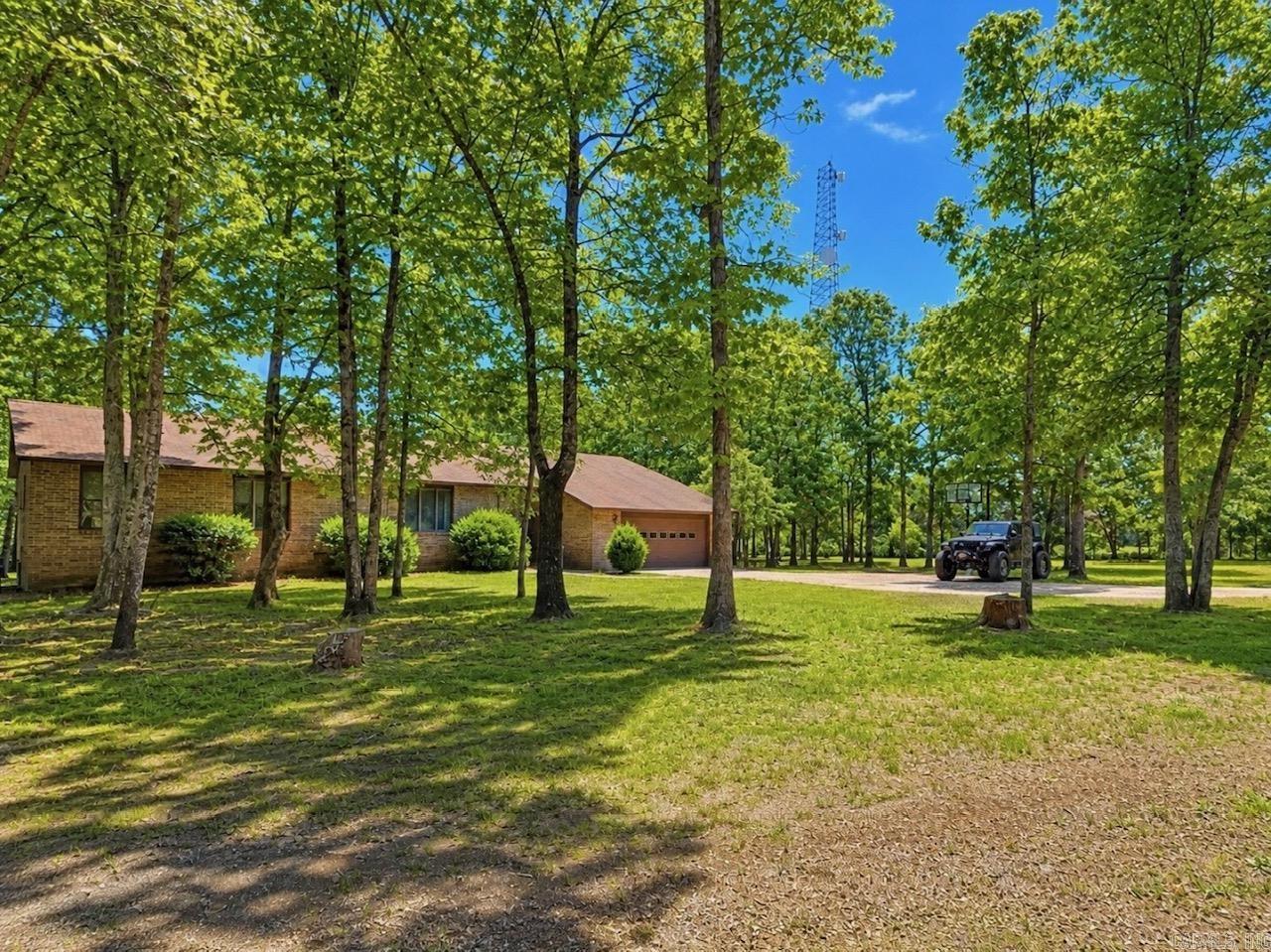Welcome to 13160 Heber Springs Rd N in Locust Grove, just outside of Batesville. This spacious property offers 3 bedrooms, 2 bathrooms, and 2,794 square feet of living space, all situated on 2.92 acres.  The home features a kitchen with abundant cabinet space, perfect for cooking and entertaining. A versatile dining room provides the option to be converted into a fifth bedroom, giving you flexibility to fit your needs.  The primary suite includes a jetted tub—ideal for relaxing after a long day.  Outside, you’ll find two shop buildings: a 40x50 shop complete with a safe room, bathroom, and open workspace, plus an additional 14x16 storage shed for extra storage.  Enjoy the space, functionality, and peaceful setting this property has to offer.