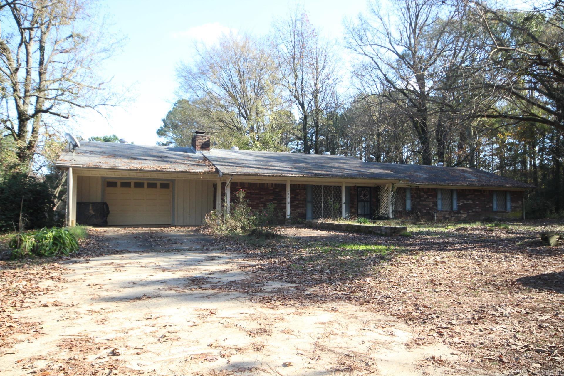 4 Bedroom, 2 full baths with approx. 1848 Sq. Ft. of living space situated on approx. 2 acres.  Kitchen has great storage (Refrigerator conveys.)  Family area features wood burning fireplace.  Spacious laundry area with great storage.  Covered patio (backporch).  Property has a 26 x 42 shop and a 20 x 32 greenhouse.