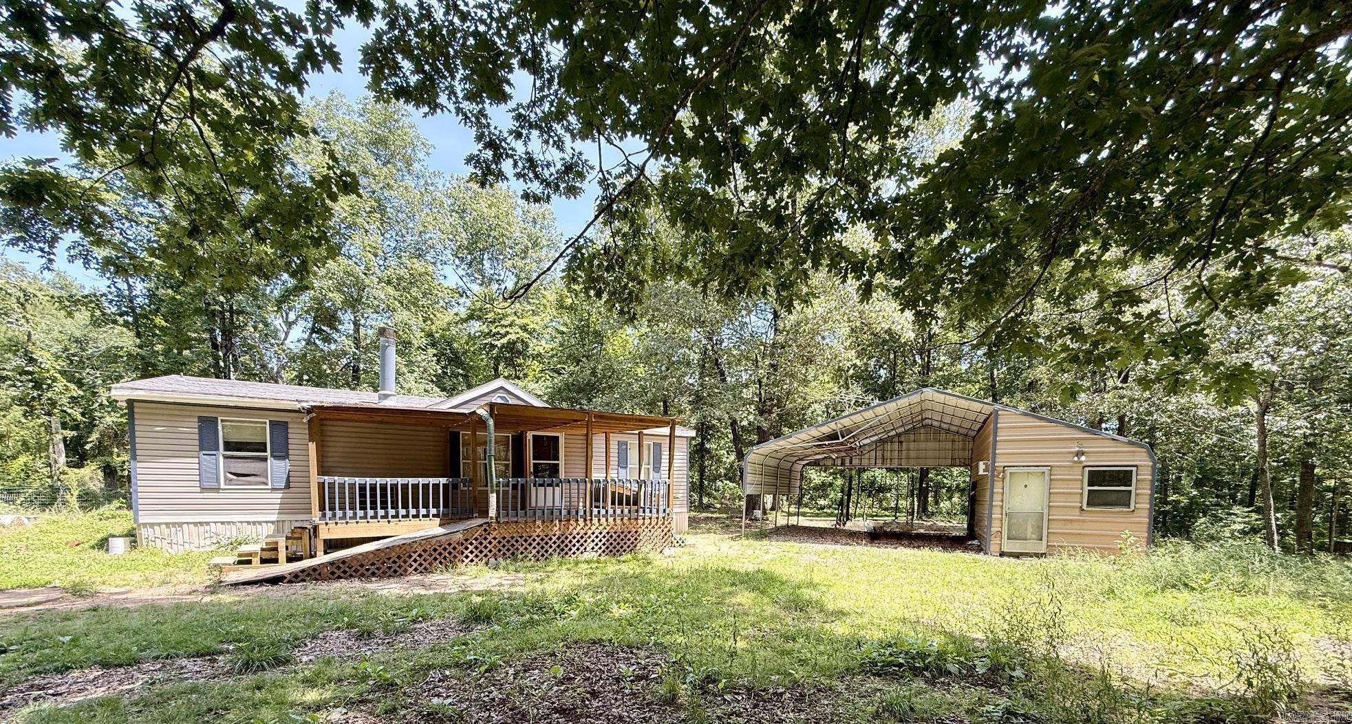 Quiet country living. Huge walk-in closet in primary bedroom. Nice level lot with detached carport with an enclosed side for a shop or storage. Only 15 minutes to Hill Creek Marina. Only 30 minutes to Mountain View.