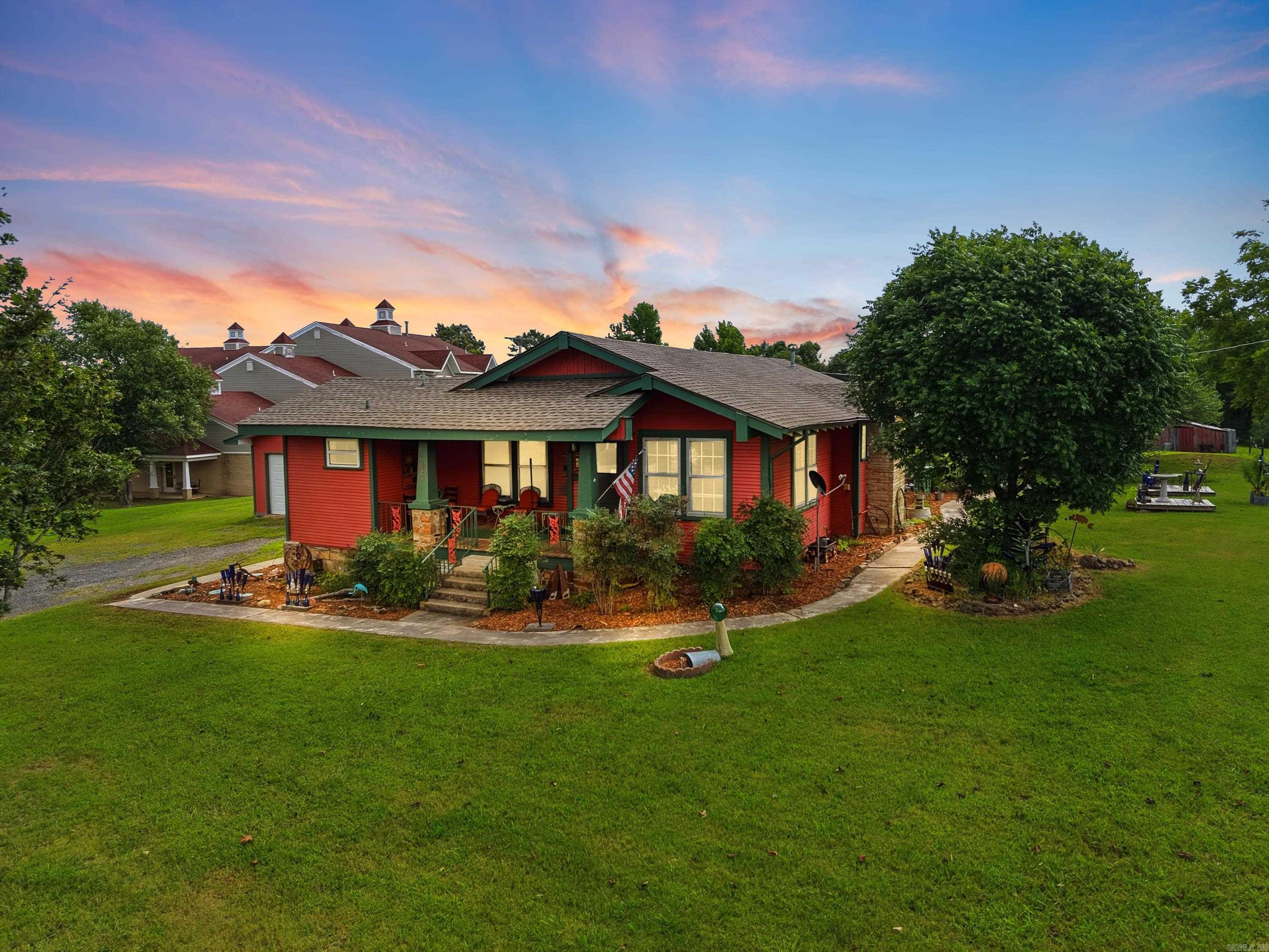 Whether you're looking for a place to call home, a location for your business, or both, this unique property offers endless possibilities! Situated on 1.54 acres, this charming 3-bedroom, 2-bath home is zoned for both residential and commercial use, giving you the flexibility to fit your lifestyle or business needs. Built in 1932, the home has been thoughtfully updated while preserving the original character and craftsmanship that make older homes so special. The central heat and air, along with the kitchen appliances, are approximately five years old, and the home had a new roof installed in 2024. Outside, you'll find the original barn, adding even more character and potential to the property. The 50' x 25' detached garage/shop features two overhead bay doors, a side entry door, 220-amp electrical service, and air conditioning, making it ideal for vehicles, hobbies, woodworking, a workshop, or extra storage. The oversized backyard provides plenty of space for kids, pets, gardening, or simply enjoying the outdoors. Beautiful landscaping, ornamental flowers, and thoughtful touches throughout the front and back yards create a welcoming setting you'll love coming home to.