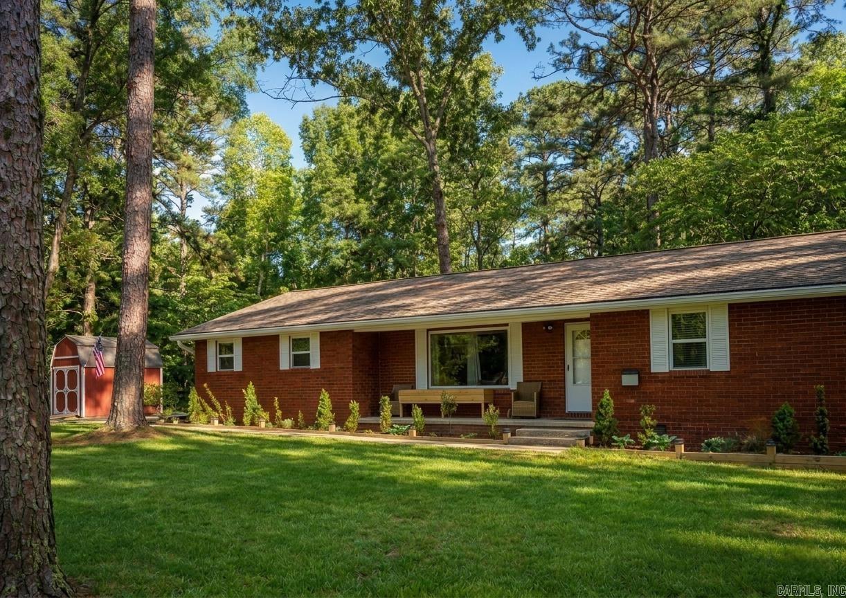 GREERS FERRY LAKE ACCESS RETREAT * 3.8 miles from Lacey’s Marina = convenient lake access.  Furniture options available to convey, as well as all stainless appliances which are less 4 years old. Every surface has been updated! The hall bath includes a soaking tub with subway tile surround. The primary on-suite provides a large custom walk-in shower, double vanity, & great storage! New energy-efficient thermal grid-free windows, luxury vinyl wood plank flooring, new paint & added disc lighting are just some of the quality finishes you'll find. The primary bedroom has a cozy sitting area—your own personal retreat. The spacious 13' × 15' covered & closed-in back deck is perfect for entertaining or relaxing while being pet friendly and baby safe. There is also a path to a pergola, which is perfect for taking in the beauty this property has to offer.  2.5 acres of flat, thoughtfully manicured trees create a peaceful private park-like setting. As an added bonus, the seller is including a one-year home warranty. 10 mins to shopping and dinning. 39 mi to Conway, 20 mi to Heber Springs & 20 mi to Clinton.