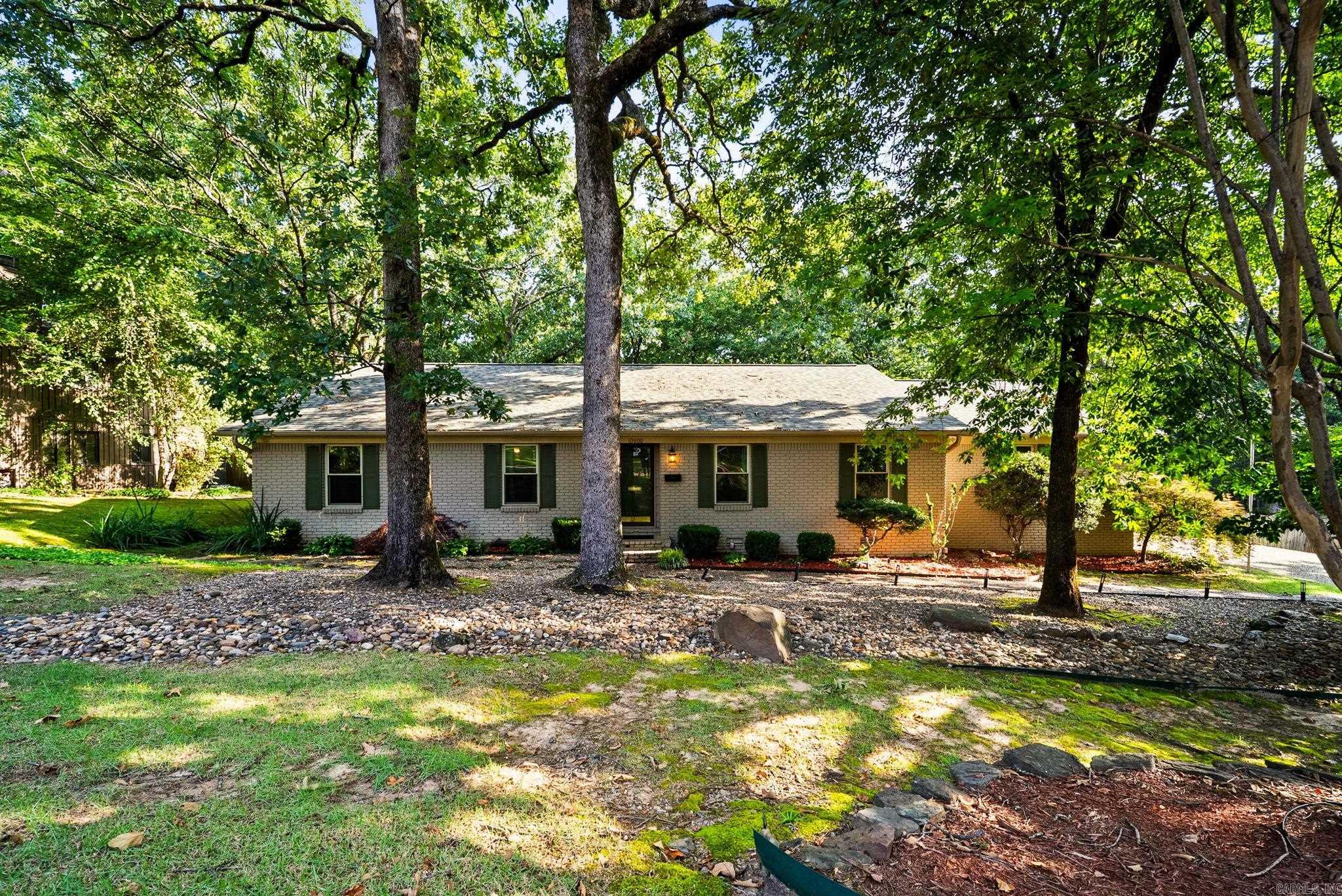RARE FIND! One-story home in Little Rock's highly-regarded subdivision, Pleasant Valley! This beautifully maintained one-story home offers the perfect blend of comfort, function, and outdoor living. Enjoy peace of mind with a new roof (May 2026), two spacious primary suites, a sprinkler system, and extensive professional landscaping. The showstopper is the incredible covered back patio featuring three separate entertaining tiers, a gas grill hookup, and a low-maintenance backyard blanketed in lush moss with two fenced areas. Inside, you'll find a flexible dining room that also makes an excellent office or second living space. The kitchen has a plethora of cabinet space, pantry closet, and instant hot water at the sink for your favorite beverage. Need storage? The floored attic and oversized two-car garage with a dedicated storage/workshop area complete with countertops and a sink have you covered. You'll love all of the extra storage spaces throughout the house. This home is less than 1 mile from I-430, but you'll love how peaceful the neighborhood is while offering convenience for travel. This one is worth seeing!