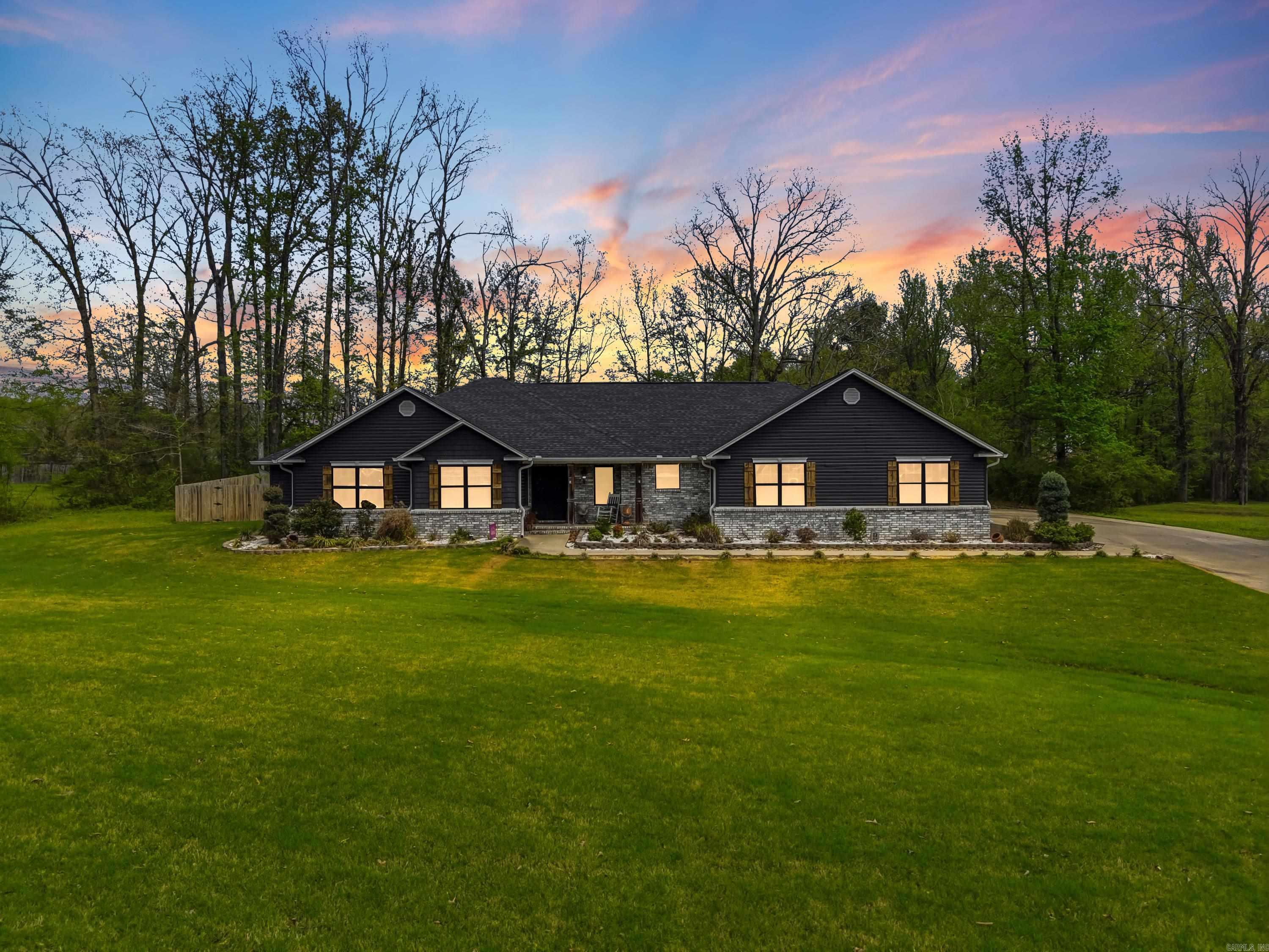 Custom-built in 2020 and situated on over an acre, this stunning 3-bedroom, 2.5-bath home offers quality, space, and thoughtful design throughout. Inside, you’ll find the entertainers dream kitchen with  marble countertops, gas double oven, along with a dedicated office and an impressive 10x11 custom primary closet. The living space is anchored by a cozy indoor gas fireplace, perfect for relaxing evenings. Step outside to enjoy the extended patio featuring a gas fireplace and plumbed for your future outdoor kitchen—ideal for entertaining. The property also includes two 30x30 garages that are fully insulated and offer the potential to be converted into additional living space if desired. A 30-amp camper hookup adds even more versatility.  Additional highlights include a whole home generator for peace of mind. - automatic start!  This home blends modern comfort with functional extras, all set on a spacious lot—offering the perfect balance of indoor luxury and outdoor living.