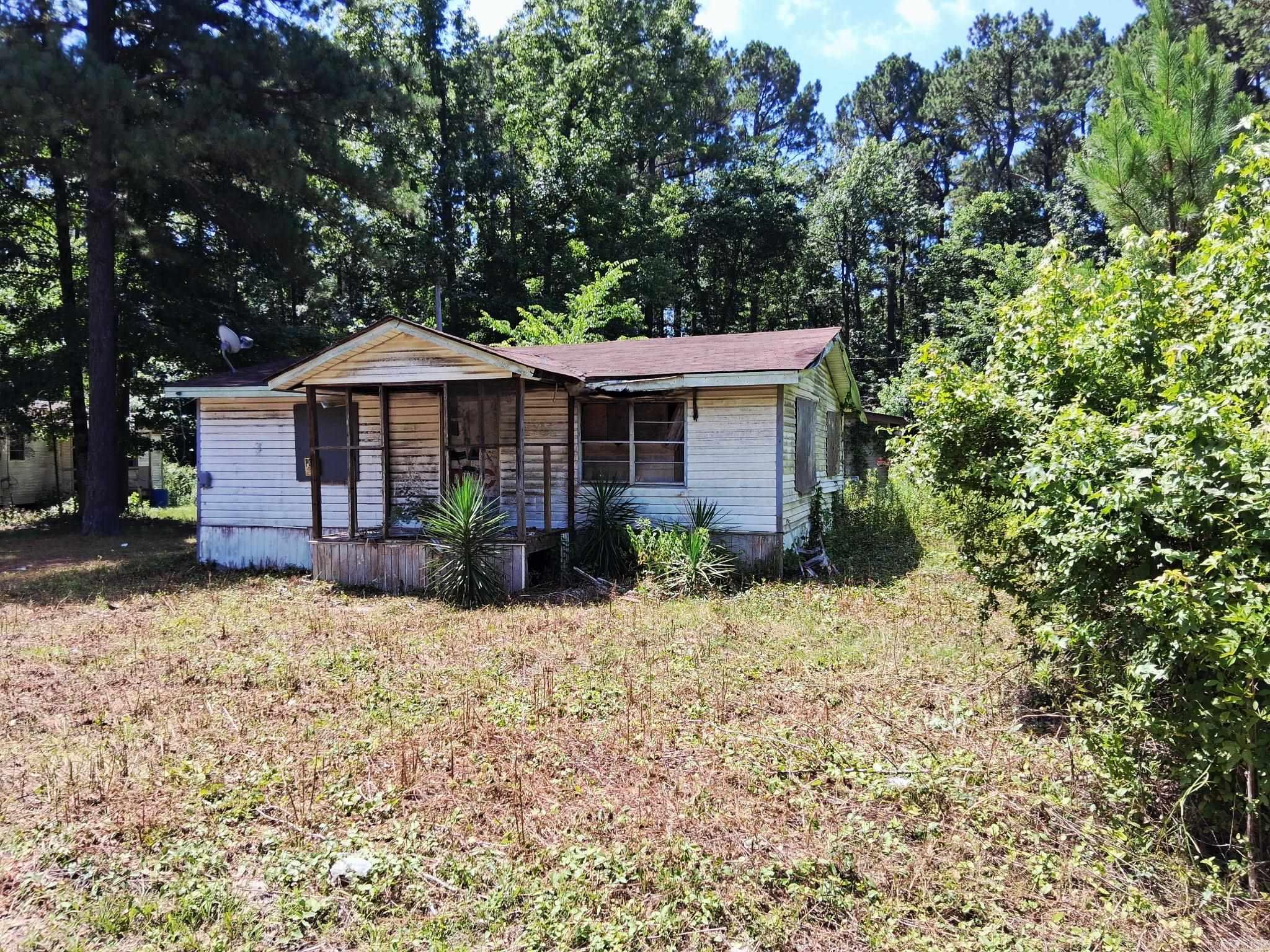 Investor Special – Two Homes for the Price of One! Great opportunity for investors, contractors, or handy buyers looking for their next project. This property includes two homes situated on approximately 0.46 acres in rural Little Rock. The primary home is approximately 1,260 SF, and the second home is approximately 832 SF. Both homes are being sold AS-IS, WHERE-IS and require extensive repairs. Seller has never occupied either home and has little to no knowledge of the property's condition or history. No repairs, warranties, or representations will be made. All information, including square footage, lot size, age, condition, utilities, and other property details, is believed to be accurate but is not guaranteed. Buyers are strongly encouraged to verify all measurements and perform any inspections or due diligence they deem necessary prior to closing. Priced accordingly and full of potential for renovation, rental income, or redevelopment. Cash only. Agents see remarks.