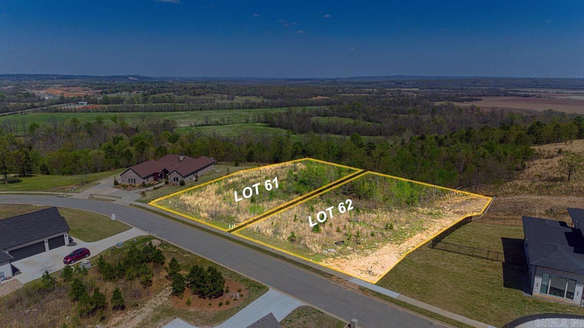 Bring your floor plans and visions to life with this amazing 0.71-acre homesite in this premier gated subdivision! This lot offers a rare vantage point with phenomenal views of the agricultural valley, providing a peaceful ever-changing backdrop for your custom- build estate. Positioned with great convenience, you are just a 20-minute drive from the dining and shopping of North Little Rock, West Little Rock and Conway. All utilities are underground including high-speed internet access making this lot as functional as it is beautiful. Looking for even more privacy or a larger footprint? The adjacent lot is also available for purchase, creating a unique opportunity to create a 1.3+ acre refuge. 2,500 Minimum Sq. Ft to build. See Agent Remarks.