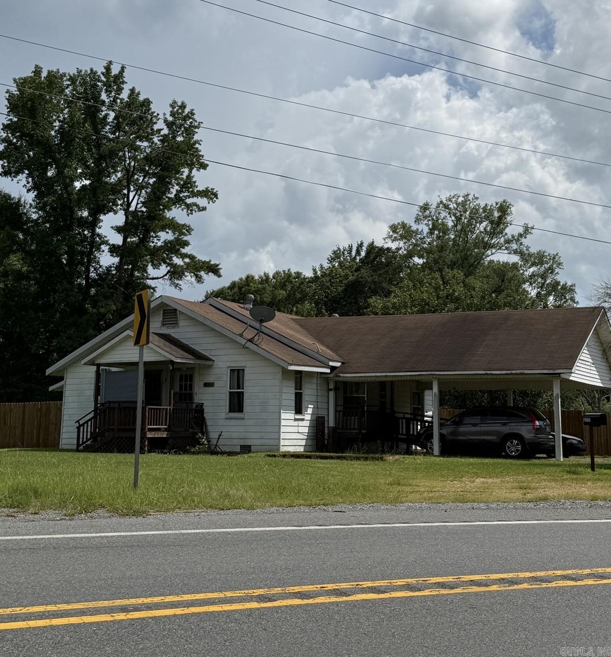 This 2 BR 2 Bath fixer upper is a nice 2 acre rural property with fishing pond and multiple out-buildings is perfect for someone wanting to farm or garden.  Current owner has been growing vegetables, raising goats, has a few chickens, and 2 workshops. Lots of living on a manageable place. Newer central HVAC. Property has a well and rural water. Schedule a viewing appointment today.