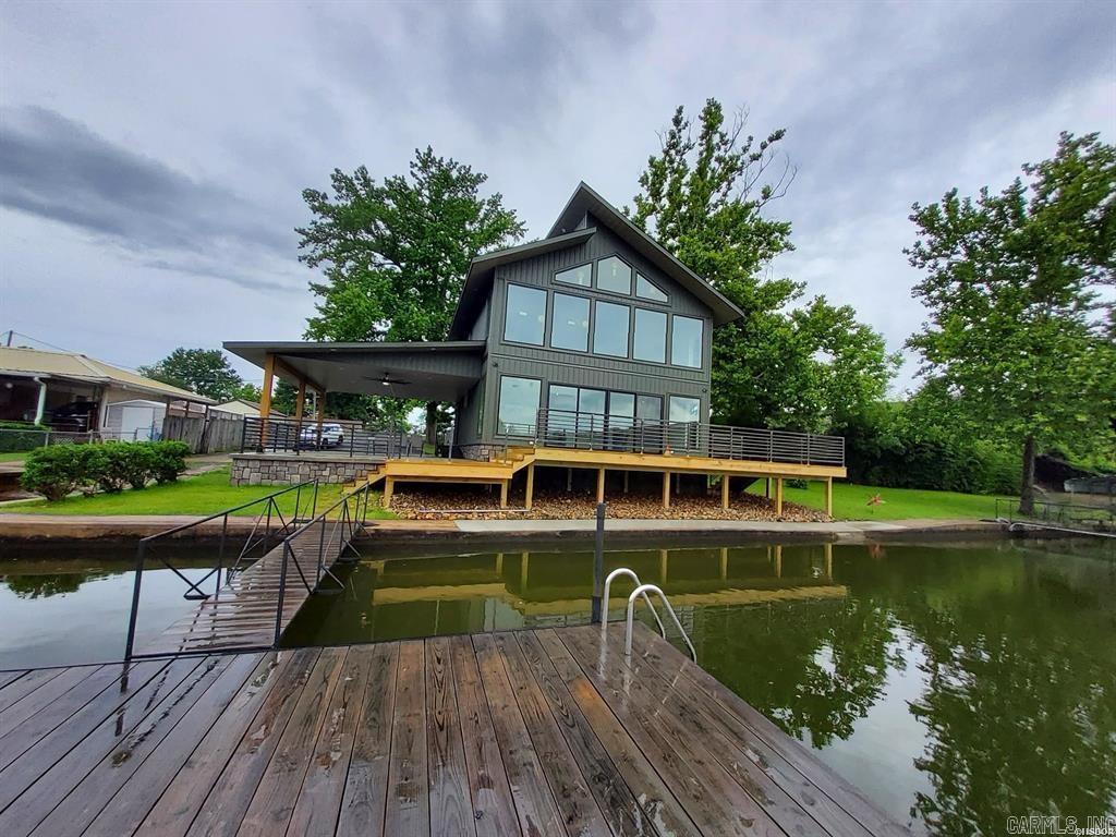 Lakefront living at its best is almost complete in this beautifully crafted home featuring upscale finishes and spacious designs.  Your private launching ramp is rare.   The huge covered patio and deck are perfect for relaxing and entertaining.  Upper loft area will give endless options of living space.  Professional pictures will be taken after construction is completed.