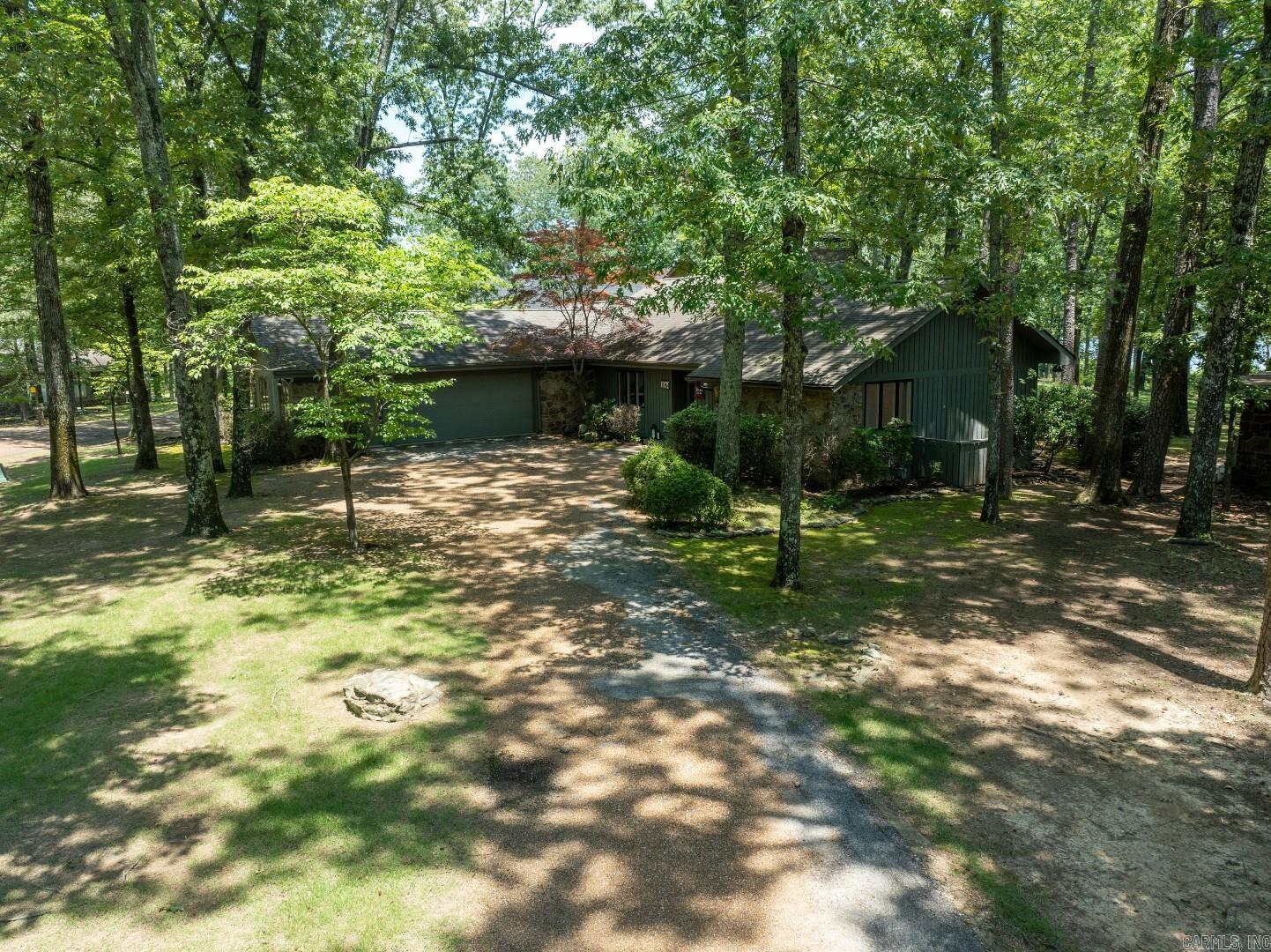 Eden Isle LAKEFRONT!  This lovely 3-bedroom/3-bath home has been completely updated and is completely furnished!  Located just north of Eden Isle Marina, this is a highly sought after location with great lake views, large open floorplan, cathedral ceilings and stone fireplace, split bedroom plan, very large 2-car garage, lovely covered back deck and tons of glass!  Inside and out...all is in excellent condition! ***Sale price was $1,050,000 for the house and 65k for the furnishings.