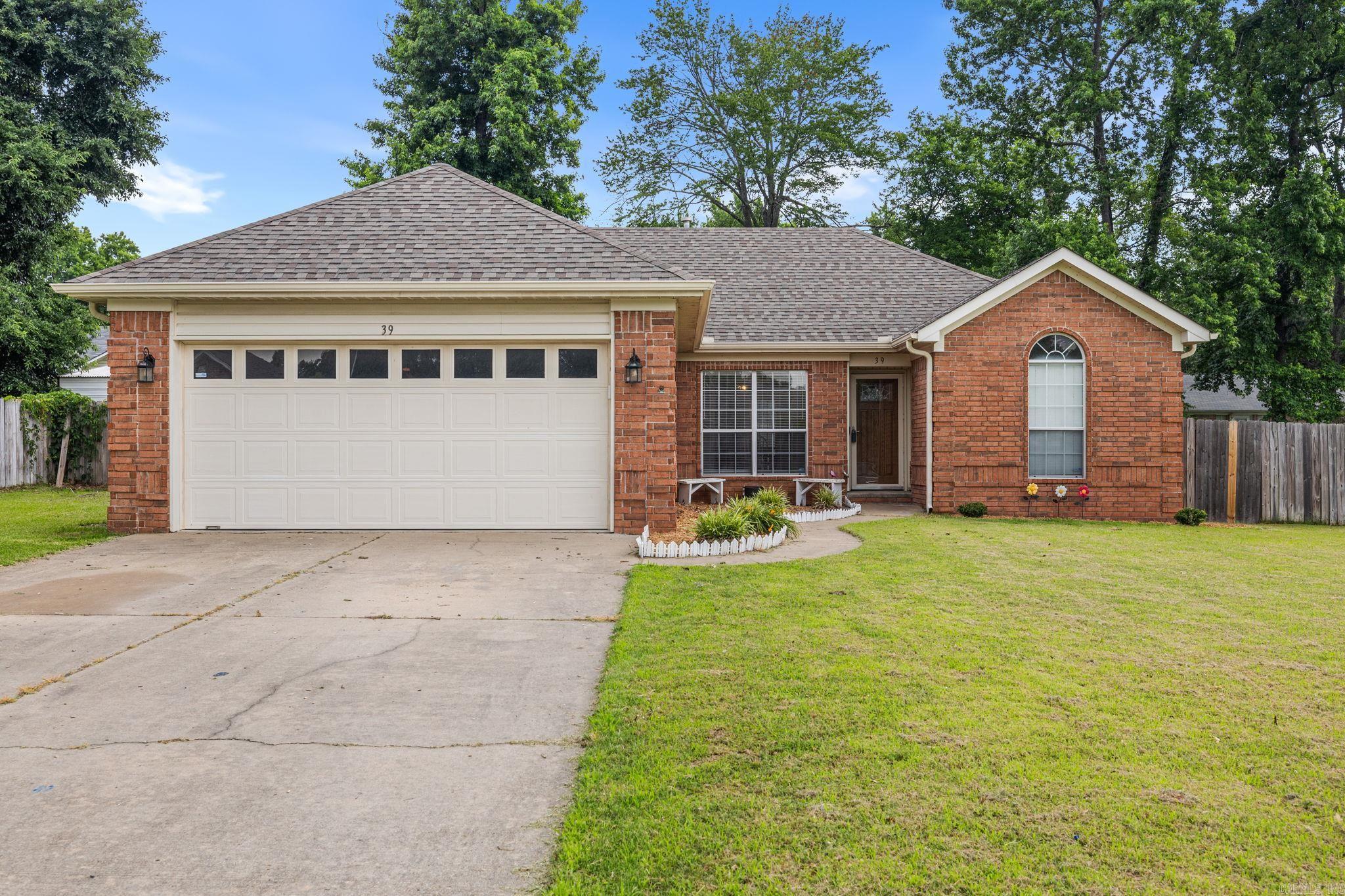 Welcome to 39 Robin Street in Cabot! Conveniently located in the heart of town and within walking distance to Central Elementary School, this move-in ready home offers comfort, convenience, and peace of mind. Featuring 3 bedrooms and 2 bathrooms, this home sits on a flat lot with a fully fenced backyard, providing plenty of space for pets, entertaining, or simply enjoying the outdoors. Recent updates include a new roof, fresh paint, and an updated primary shower, making it easy to settle right in. The spacious primary suite is thoughtfully separated from the secondary bedrooms and features dual sinks, dual closets, and a private bath, creating a comfortable retreat at the end of the day. For added peace of mind, the garage includes a storm shelter, a valuable feature Arkansas homeowners will appreciate. With its central location, functional layout, and recent improvements, this home is ready for its next owners. Schedule your showing today!
