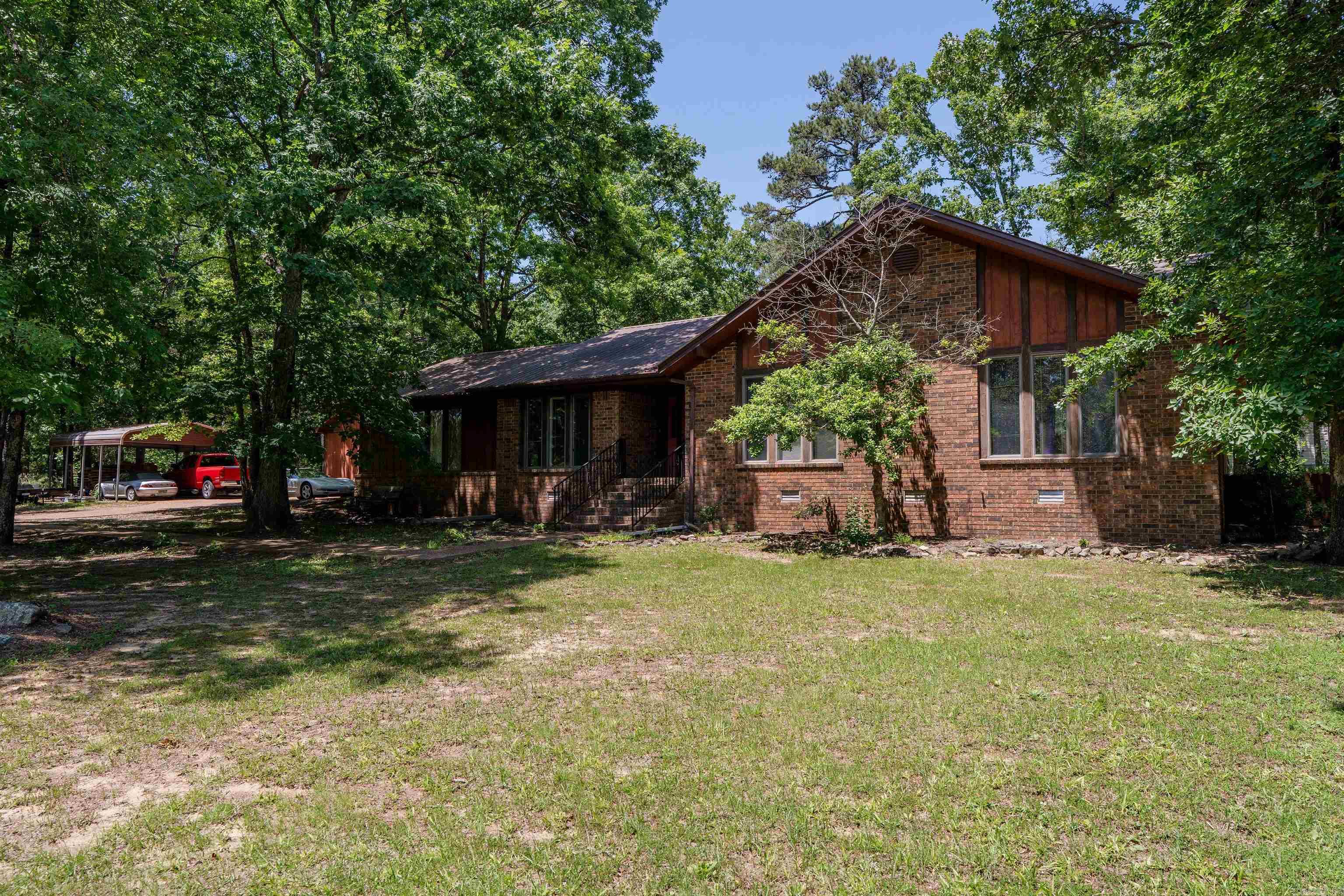 Beautifully positioned atop the mountain in the highly sought-after Mountain Aire subdivision of Heber Springs, this custom-crafted home sits on one of the neighborhood’s first and finest corner lots, surrounded by mature trees, native stone, and natural beauty. Offering approximately 1,850 SF, it features 3 bedrooms, 2.5 baths, an attached 660 SF two-car garage, and an impressive 1,440 SF detached shop ideal for boats, trucks, ATVs, hobbies, or storage. The level wooded lot is enhanced by surrounding natural tree cover, creating added privacy and a peaceful setting, with excellent potential for a future pool, fence, or outdoor living space. Located in one of Heber Springs’ most desirable communities, this is a rarely available opportunity where mountain living, privacy, and potential come together. Don’t miss your chance to own a true Mountain Aire standout—schedule your showing today.