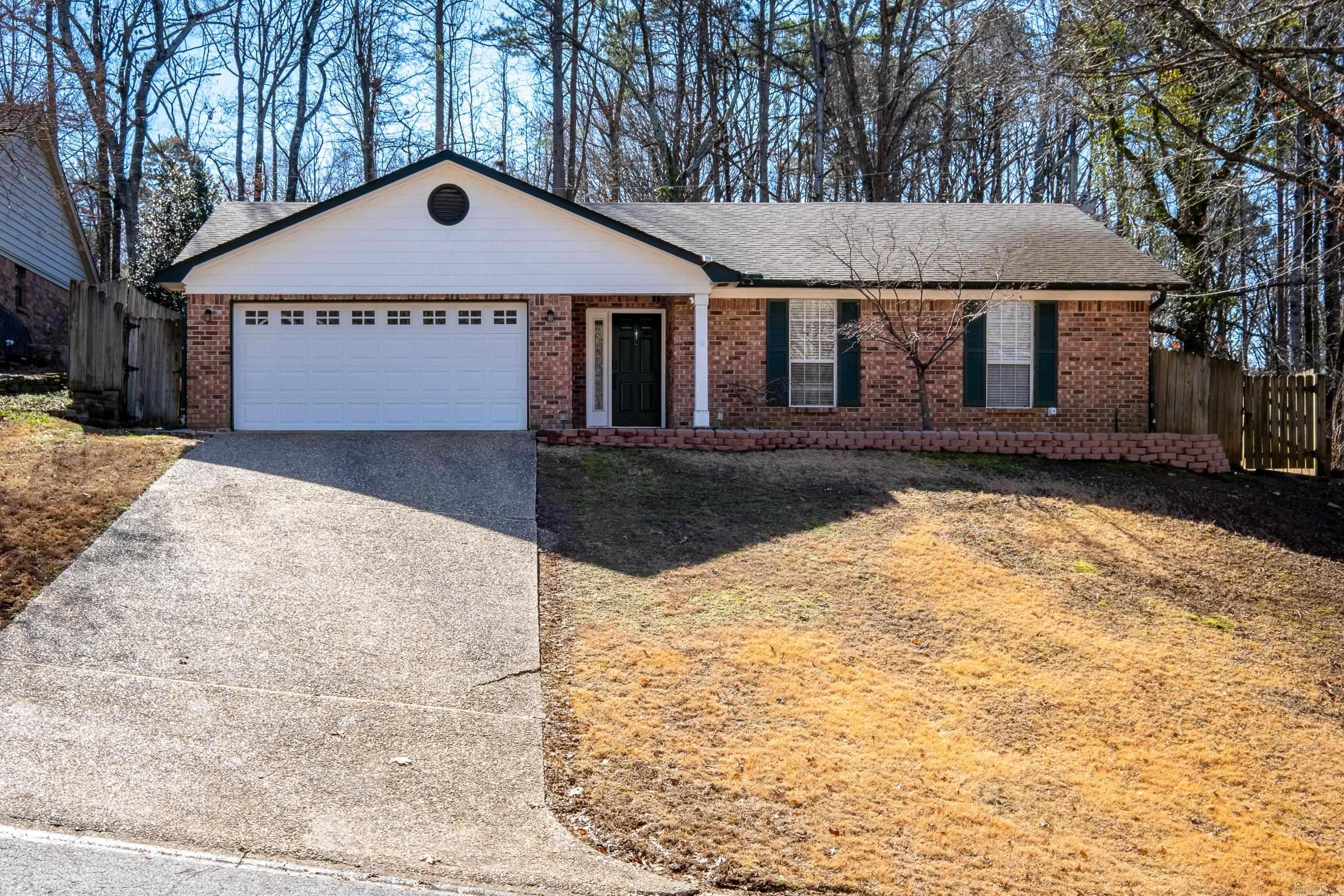 Don't miss this one-story home in West Little Rock that backs up to greenspace.  Quiet street, close to shopping and restaurants, gutters, and two car garage.  Updates throughout - New cabinet hardware, light fixtures, interior paint, fans, flooring, and master bath.  New fence, deck, and Trane HVAC.  Spacious living room with entertainment built in and gas log fireplace.  Hardwood floors throughout.  A MUST SEE!