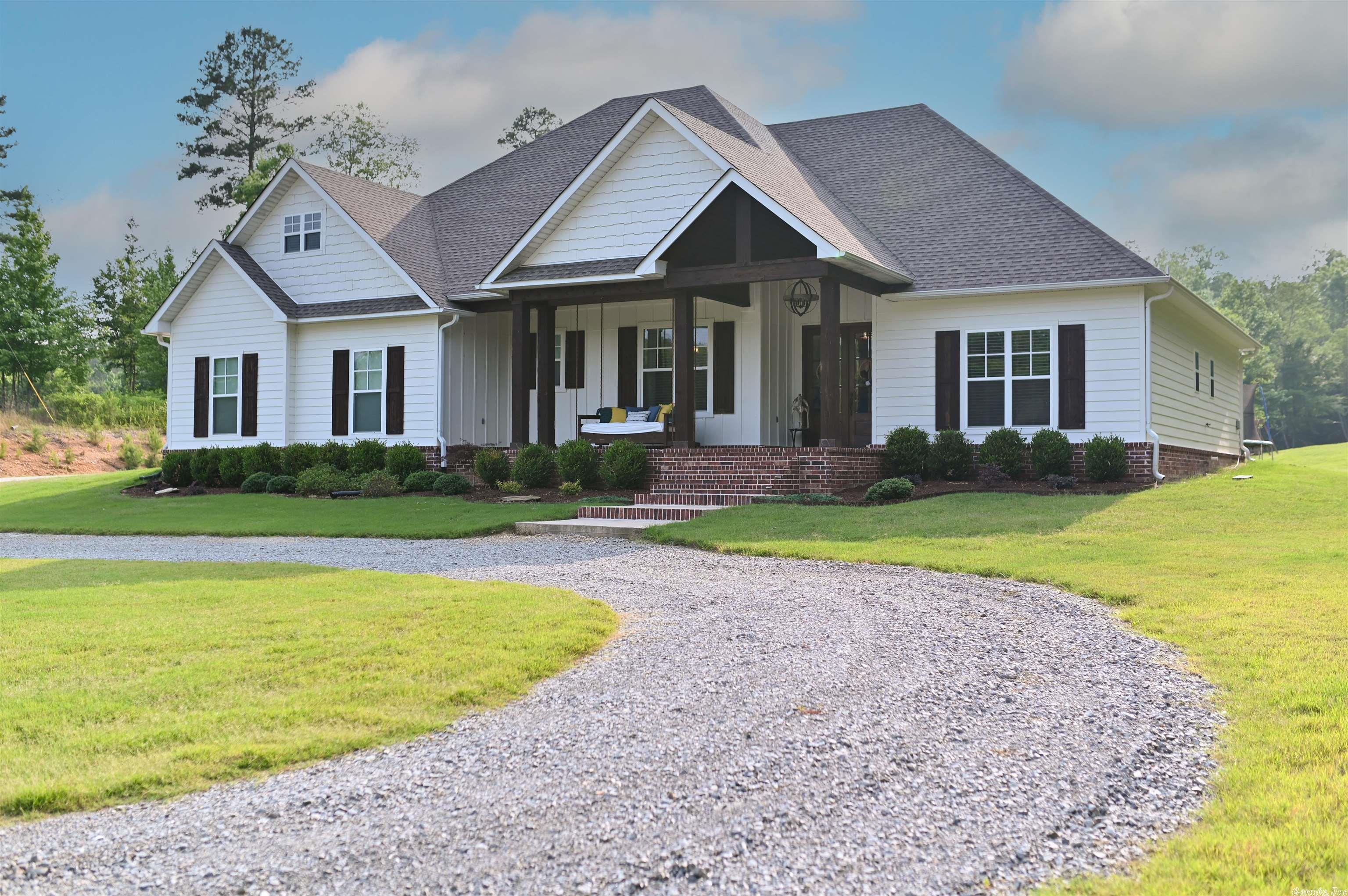 This house has it all! Beautiful custom built home with all the amenities you will love! Walk in pantry, granite countertops, laundry room connected to the master suite, and a gorgeous view from the living room and master suite. Each bedroom has its own bathroom, and walk in closet. Open concept kitchen and living room. Bonus space upstairs for a media room/game room with a small bedroom.  There is a shop in the back to hold all your "toys. Come sit on the dock, and drop a line. The fish are always biting!