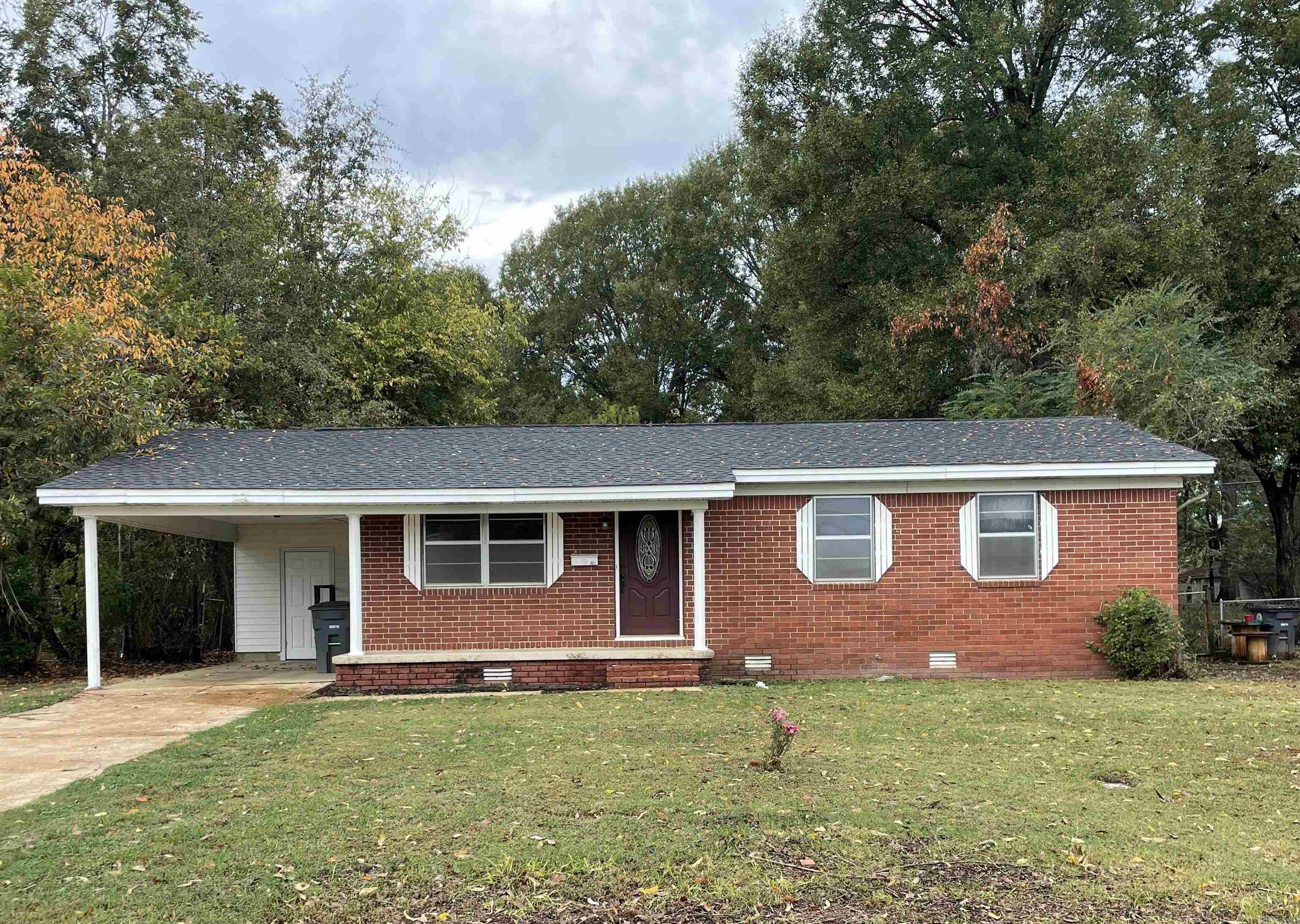 Cute and completely updated brick house in the middle of Searcy. Original hardwoods in the bedrooms and living room; new (2023) flooring and kitchen cabinets just installed, new stove and window treatments, new interior and exterior doors, light fixtures, ceiling fans and baseboards.  Bathroom remodeled in 2022. New roof in 2021. HVAC (2.5 ton) installed in 2020. Storage building with new flooring and a large fenced back yard complete the package.