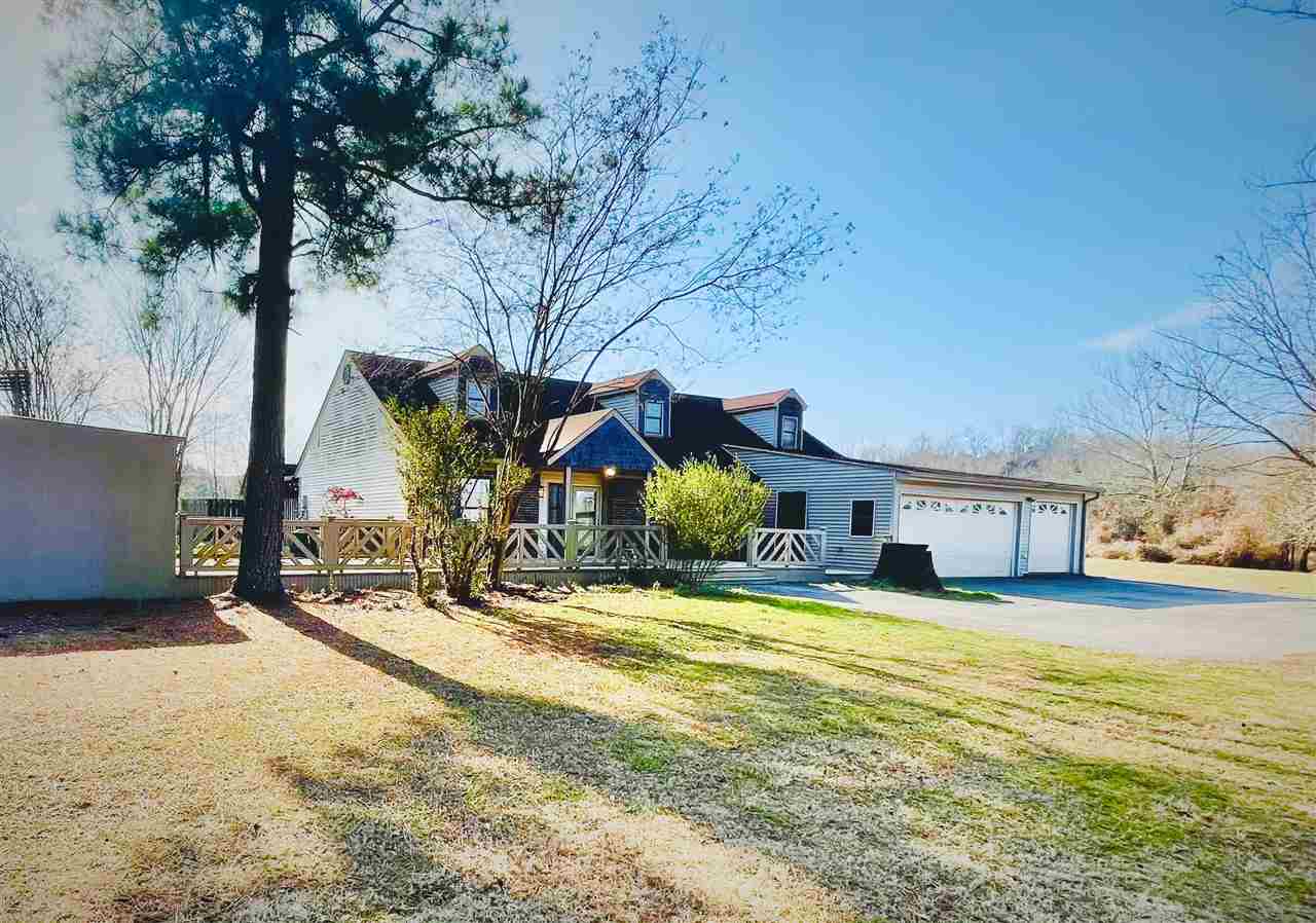 This peaceful country setting on over 8 acres could be yours! Several outdoor entertaining areas, extensive decking, fire pits, screened porch. Oh, and did I mention a lovely and refreshing in ground pool?!? Large pole shed, 3 car garage for added storage options. Inside the home, you'll find 2 guest bedrooms downstairs, with spacious master and additional bonus/office area upstairs.  Bonus! Manufactured home to convey at rear of property at no value. See docs for full list of updates and features.