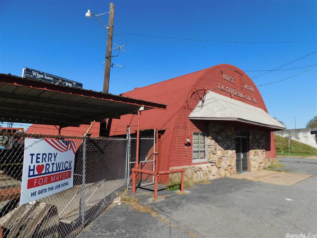 First time ever available!  Epperson House Moving Building/Warehouse just adjacent to I-30 and highly visible from the Interstate.  4200 sf+/- on .86 acres+/- the property includes a billboard that is leased to Lamar advertising for $10,000 a year.  It also includes several outbuildings and a large hoist.  The lot of .16 acres across 13th street is included.  There is also an additional lot available to the north of the property.  Owner says bring offers!
