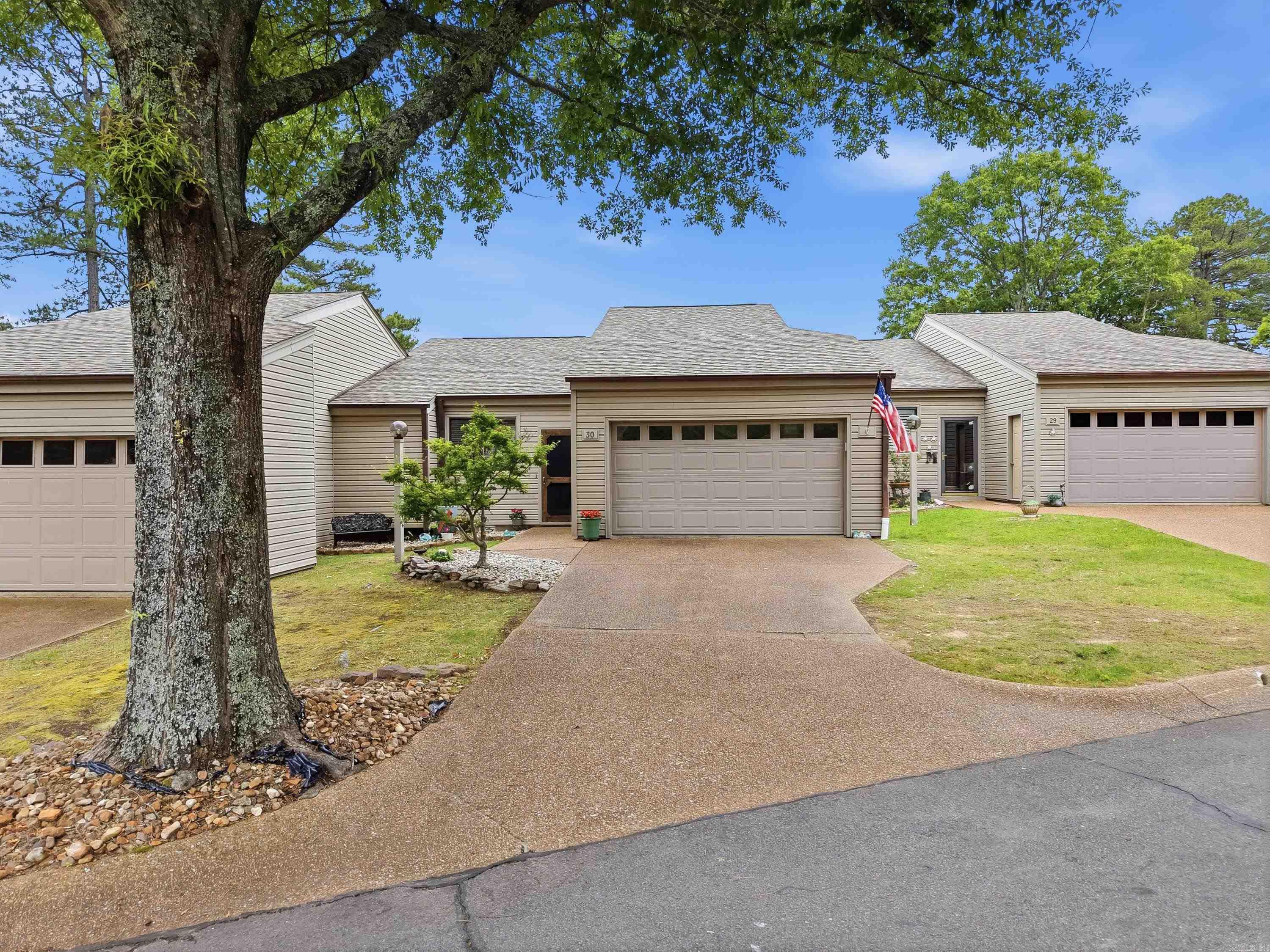 Enjoy easy golf course living in this beautifully updated townhome overlooking the fairway and green on Hole #9 of Indian Hills Golf Course in Fairfield Bay, Arkansas. This low-maintenance property offers the perfect alternative to the upkeep and expense of owning a traditional home, giving you more time to relax and enjoy the outdoor lifestyle Fairfield Bay is known for. Features include a new roof installed in 2021. New back steps. The vaulted ceilings, an open living and dining area are filled with natural light, a nice walk-in shower, and some newer appliances. The former screened porch has been enclosed with 4-panel vinyl windows, creating a comfortable sunroom space year-round, with stairs leading conveniently outdoors. A Club Car golf cart also conveys, making it easy to cruise the course or community. Located close to Greers Ferry Lake, pickleball and tennis courts, bowling, three swimming pools, ATV/UTV trails, and scenic hiking trails, this townhome is ideal for full-time living, a weekend retreat, or investment property. Being sold partially furnished.