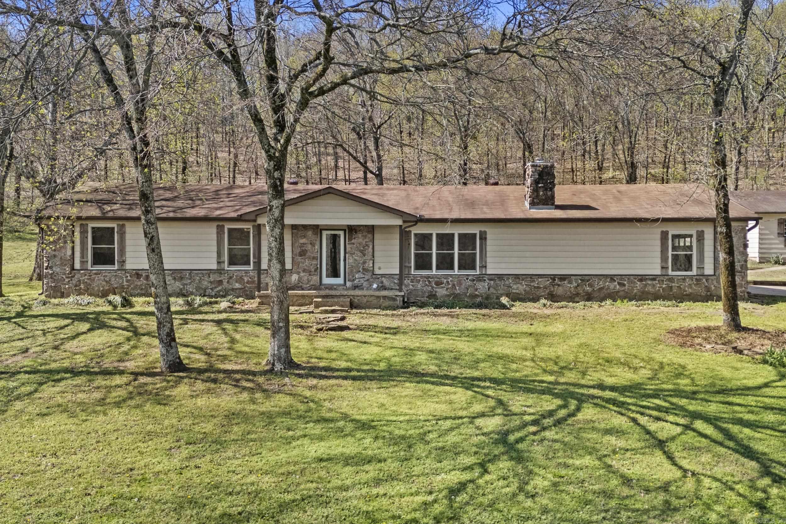 This exceptional 31-acre property located just on the outskirts of Cabot offers a rare blend of functional ranch facilities and comfortable country living just minutes from the LRAFB back gate. The property is a horse lover's dream, featuring a 48x36 horse barn and an expansive 70x140 covered riding arena for year-round training, complemented by a versatile 30x40 shop for projects and storage. At the heart of the acreage sits a well-maintained 1,866 sq. ft. ranch-style home boasting three bedrooms, an office, a cozy wood-burning stove, and a private in-ground pool perfect for Arkansas summers. This unique property provides the perfect canvas for your rural lifestyle with privacy and yet still close enough to town.