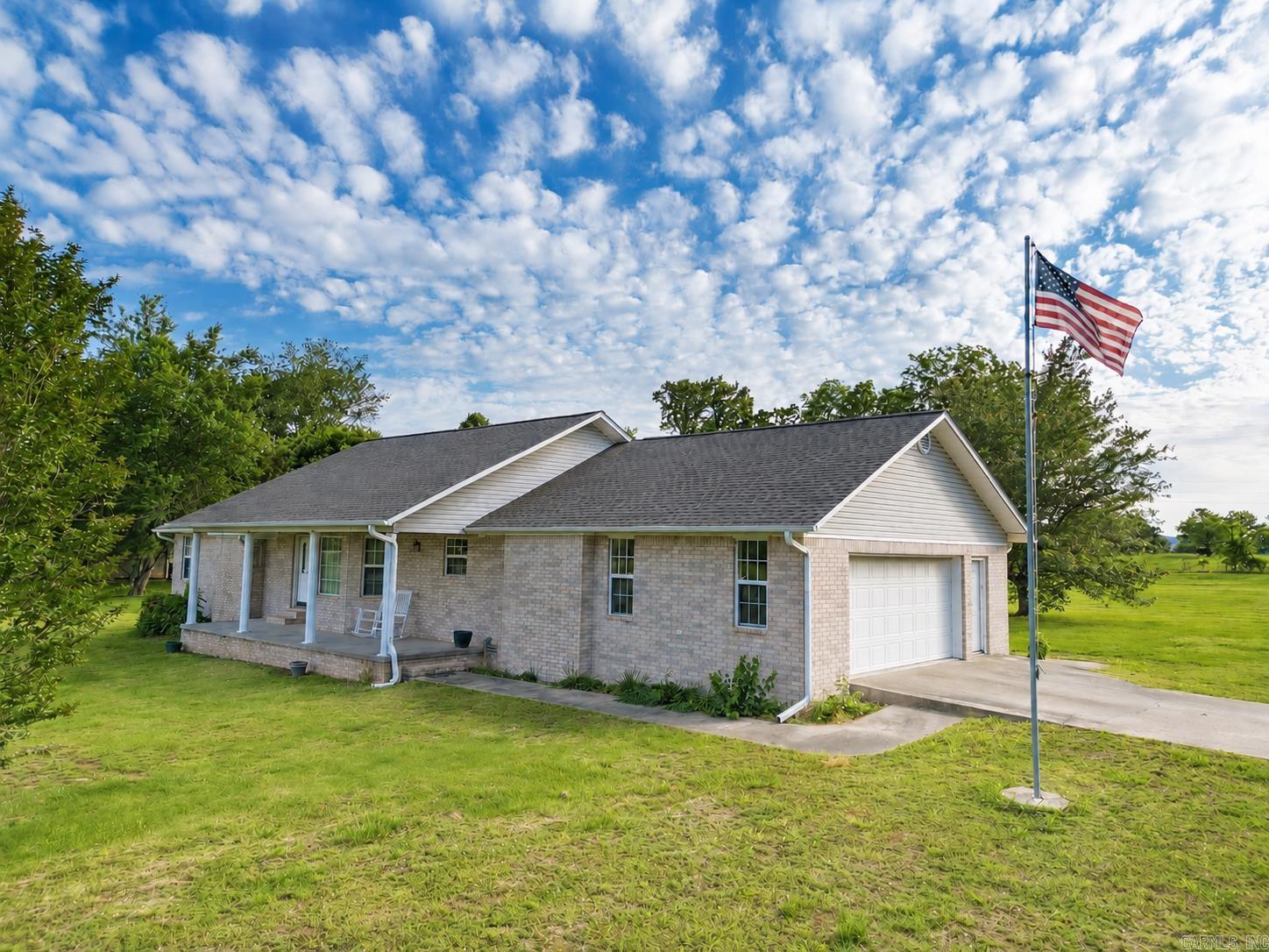 A clean, well taken care of brick 3 bed, 2 bath home on 1.45 acre level lot. Easy landscaping, just down the road from the high school.  There is plenty of space for a large garden out back within the city limits.  This size lot does not come to the market often inside the city so close to all the amenities.  This home backs up against pasture land, has a newer roof, and a very neat and clean look.  With Westwood Drive being a dead end road, you won't be counting cars going by all day. Just a short drive north, enjoy the Buffalo River as often as you like. Branson to the north, and Little Rock to the south, this home is centrally located for your needs to get out and beyond.  Interior photos coming soon.